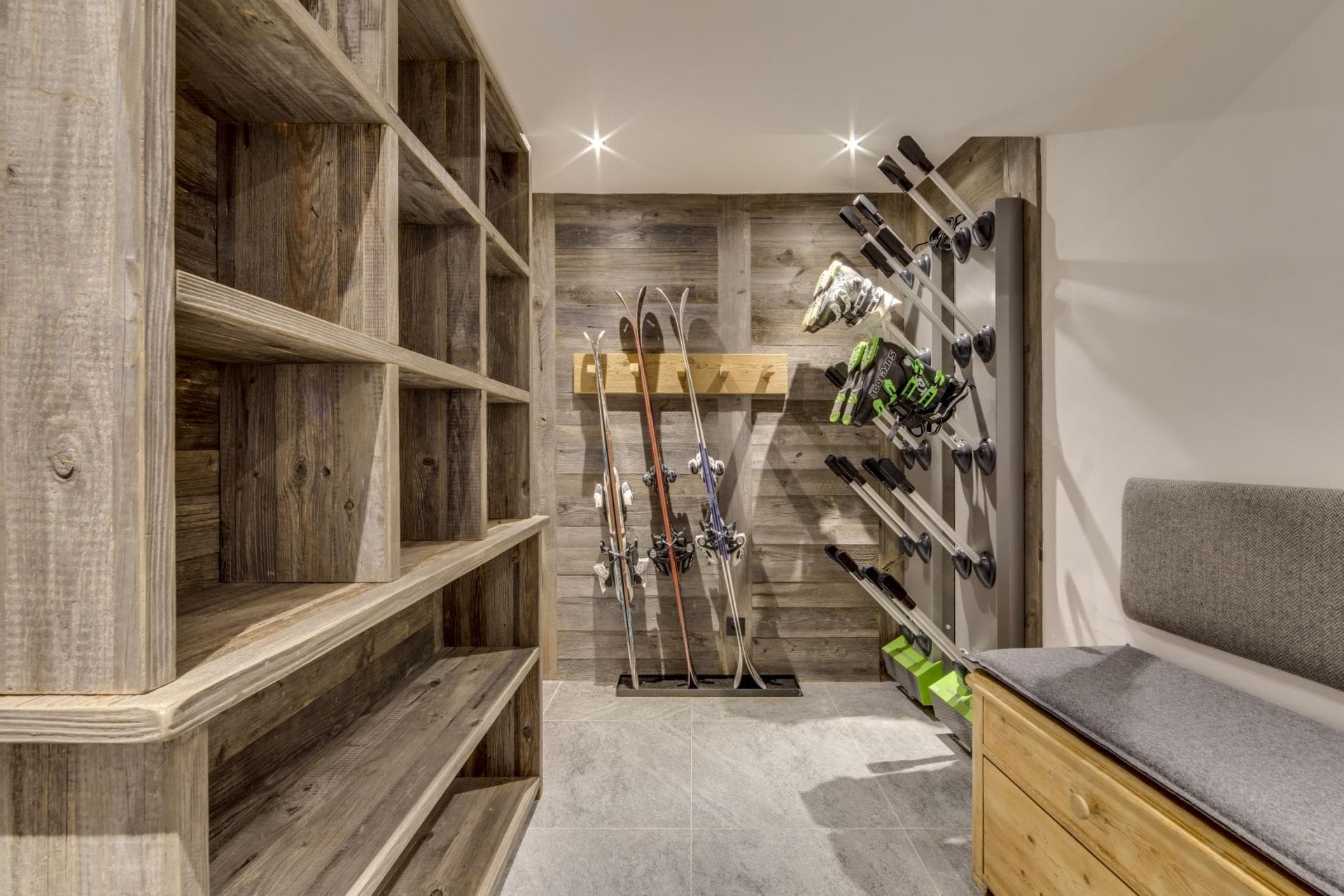 Ski room with heated boot dryers and custom wood cubbies