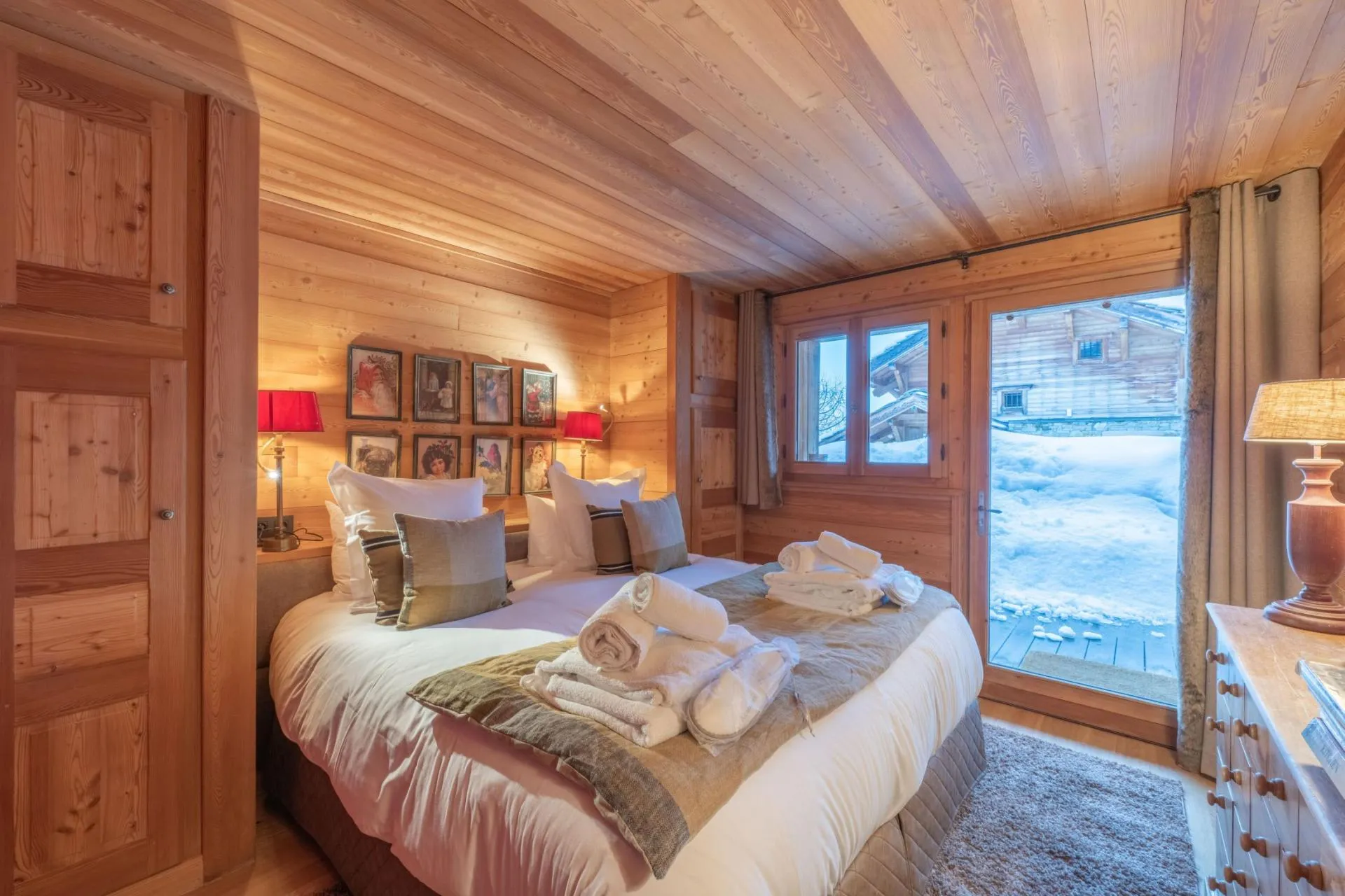Bedroom with timber panelling and terrace access