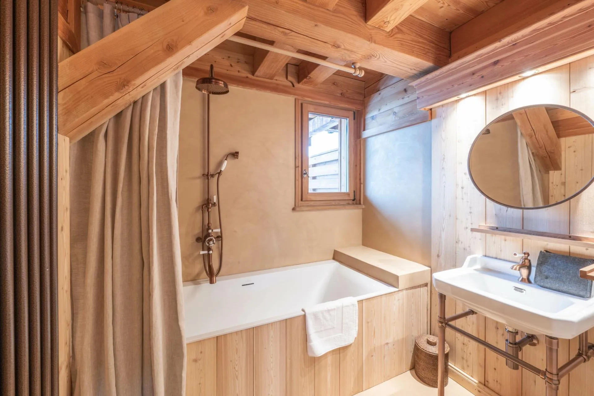 Single-bed corner area beneath exposed timber beams