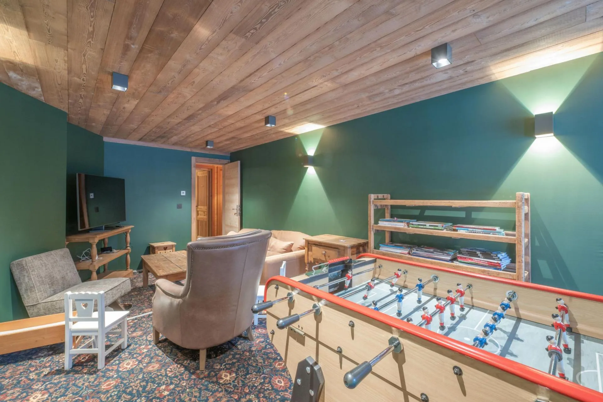Games room with table football and lounge seating