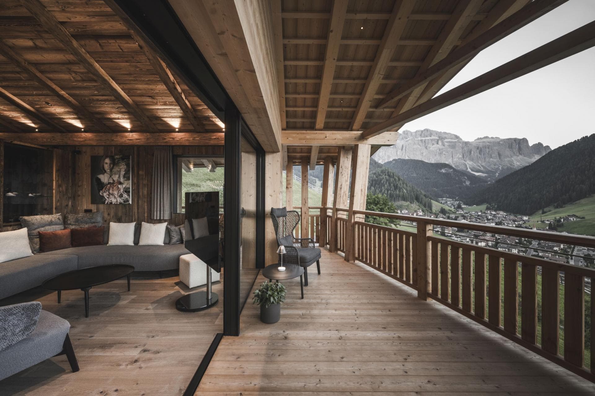 Covered timber balcony with valley views and sliding glass door access