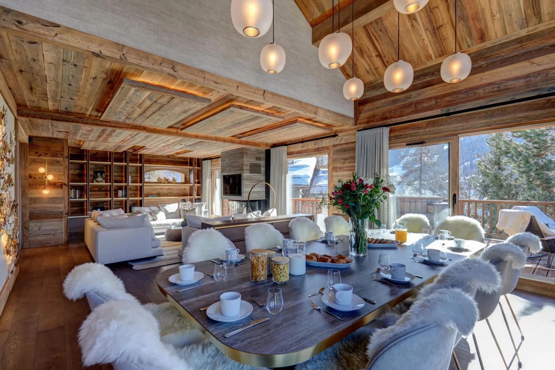 Living and dining space beneath pendant lights