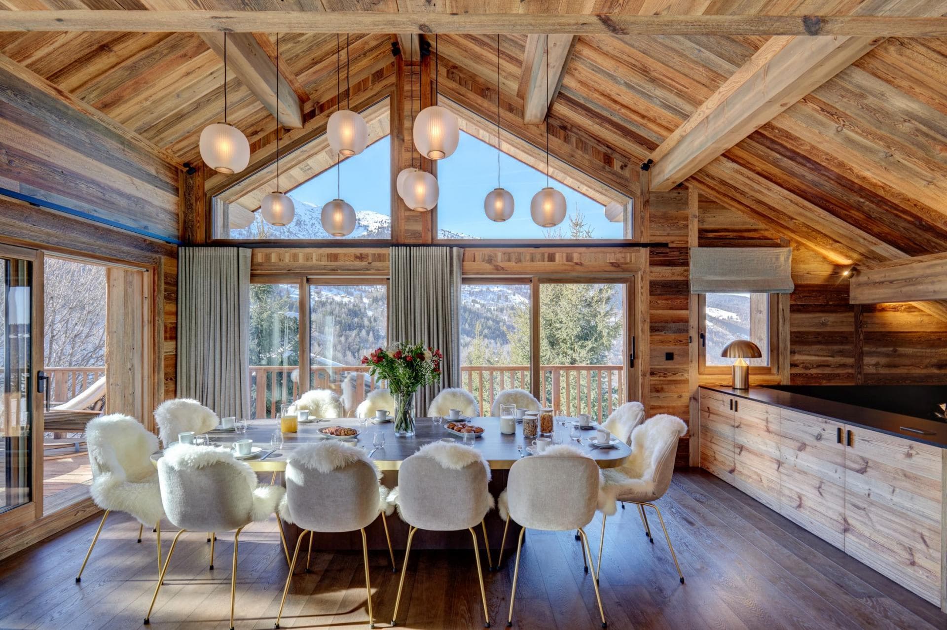 Dining table seats 10; floor-to-ceiling mountain views