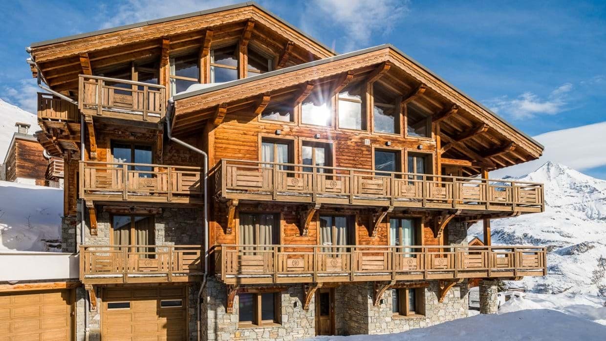 Timber chalet with private balconies on every floor and integrated garage