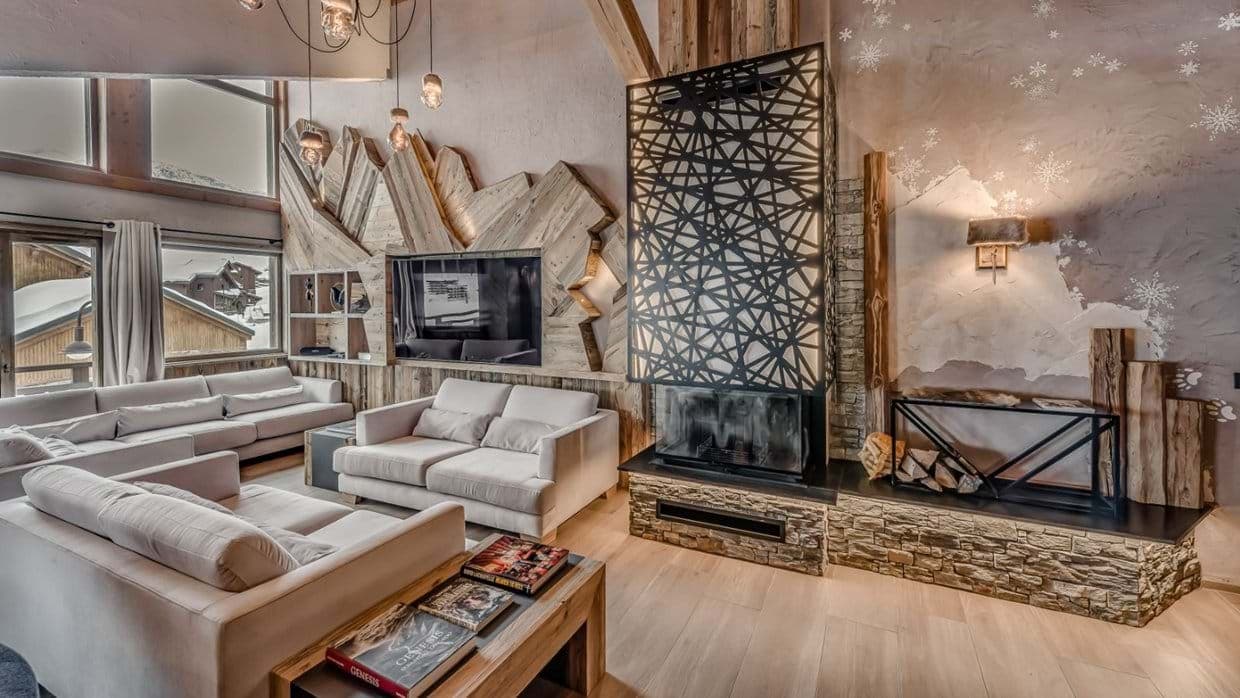 Living room with wood-burning fireplace and seating for 10