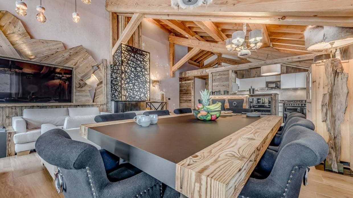 Open-plan living area with dining for 8 and vaulted timber ceilings