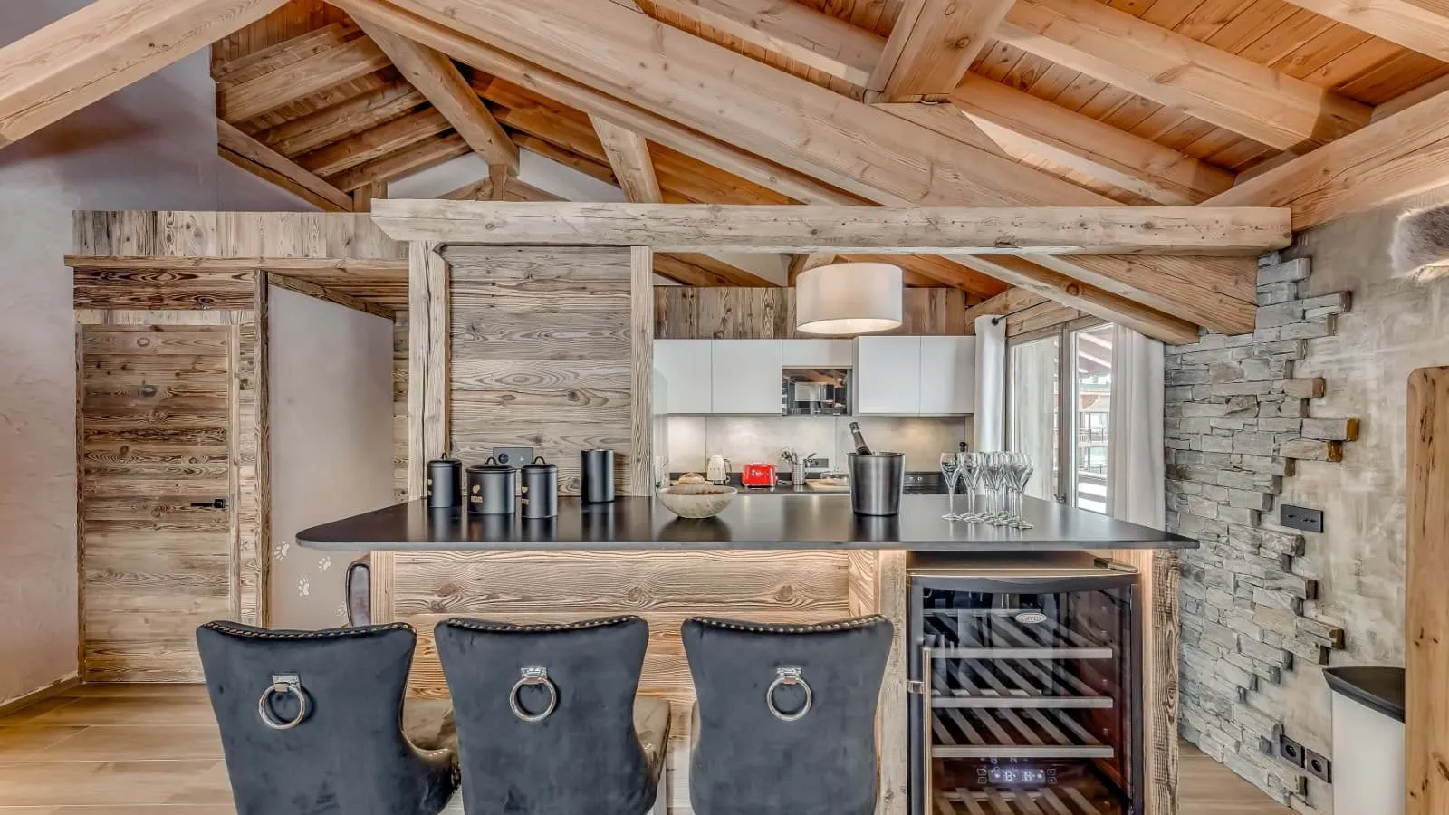 Breakfast bar with seating for three and built-in wine fridge