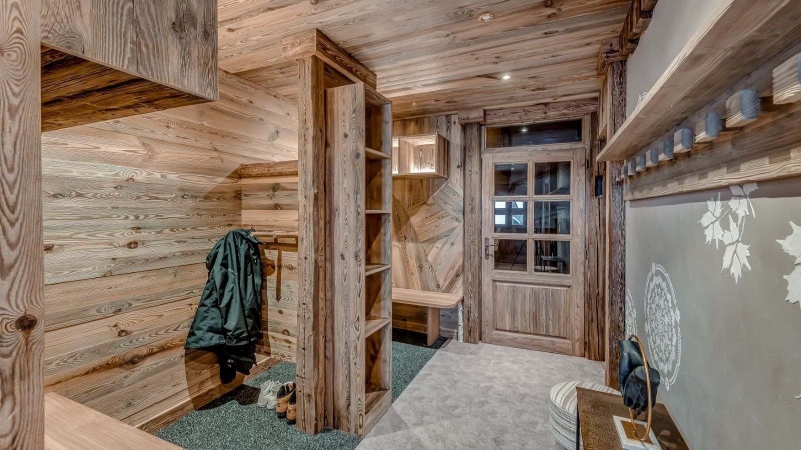 Entryway mudroom with built-in wood shelving and bench seating