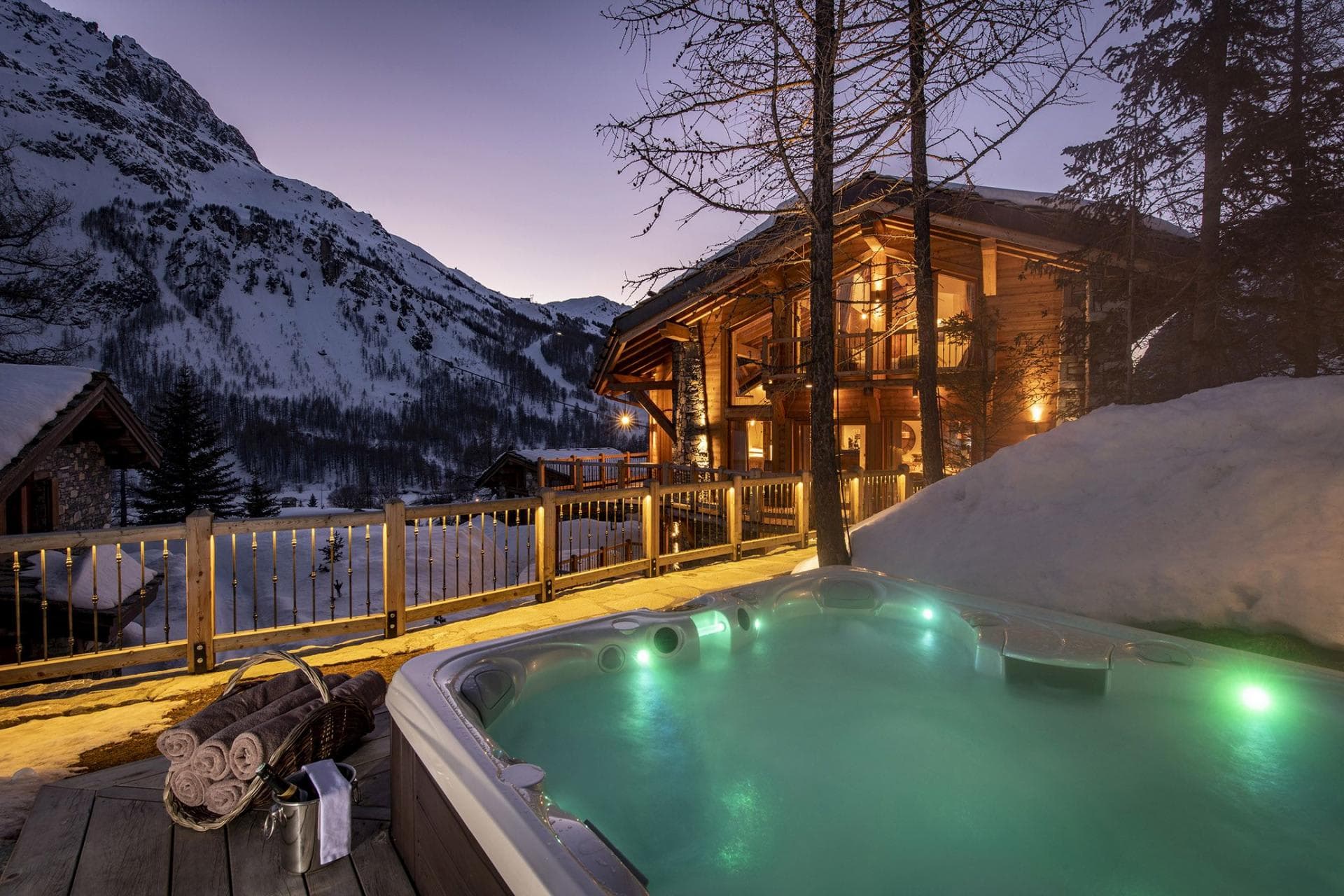 Outdoor hot tub with mountain views and adjacent ski-in access