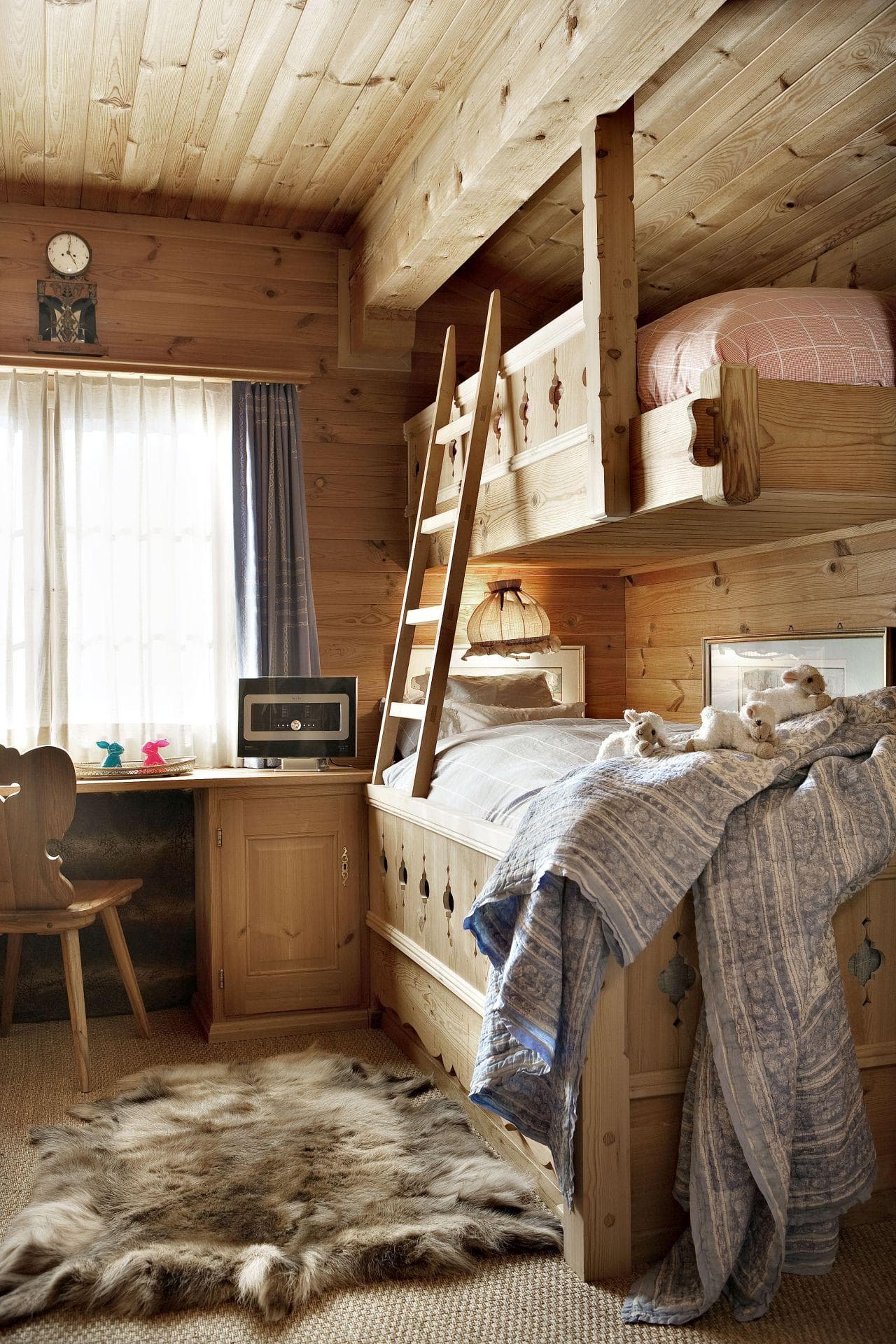 Bunk room with twin-over-twin beds and built-in desk