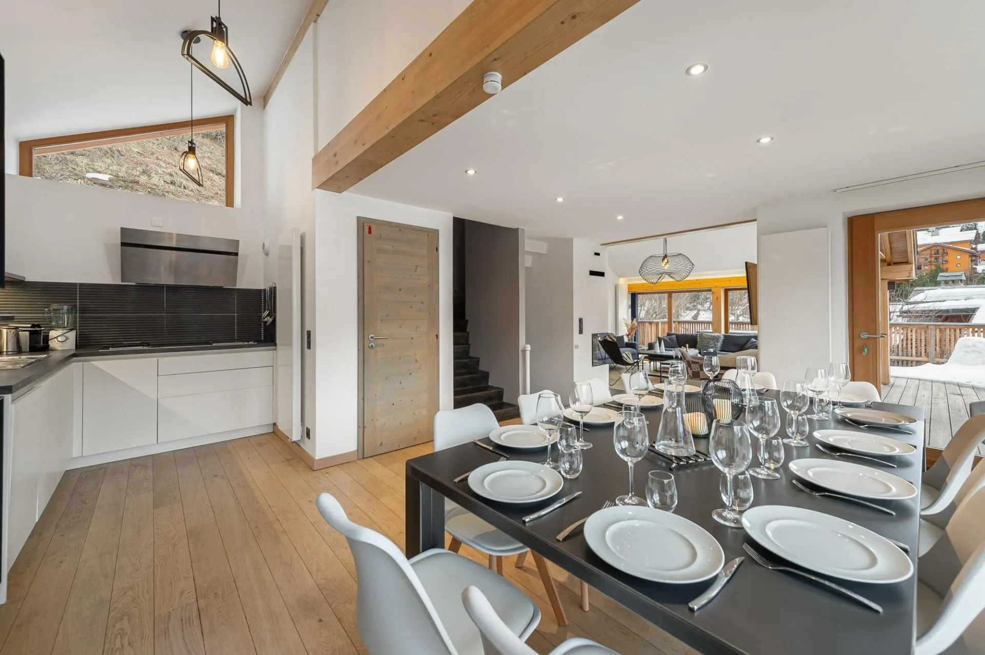 Dining area seats 10; open-plan kitchen and access to balcony
