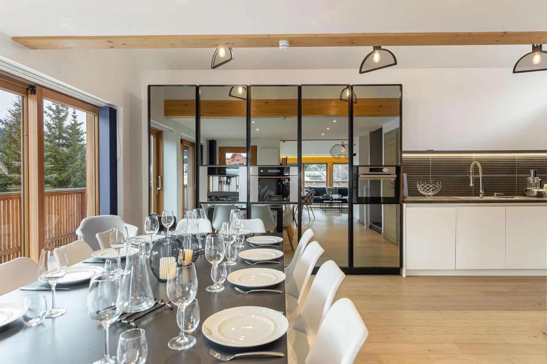 Dining area seats 12; kitchen with built-in ovens and balcony access