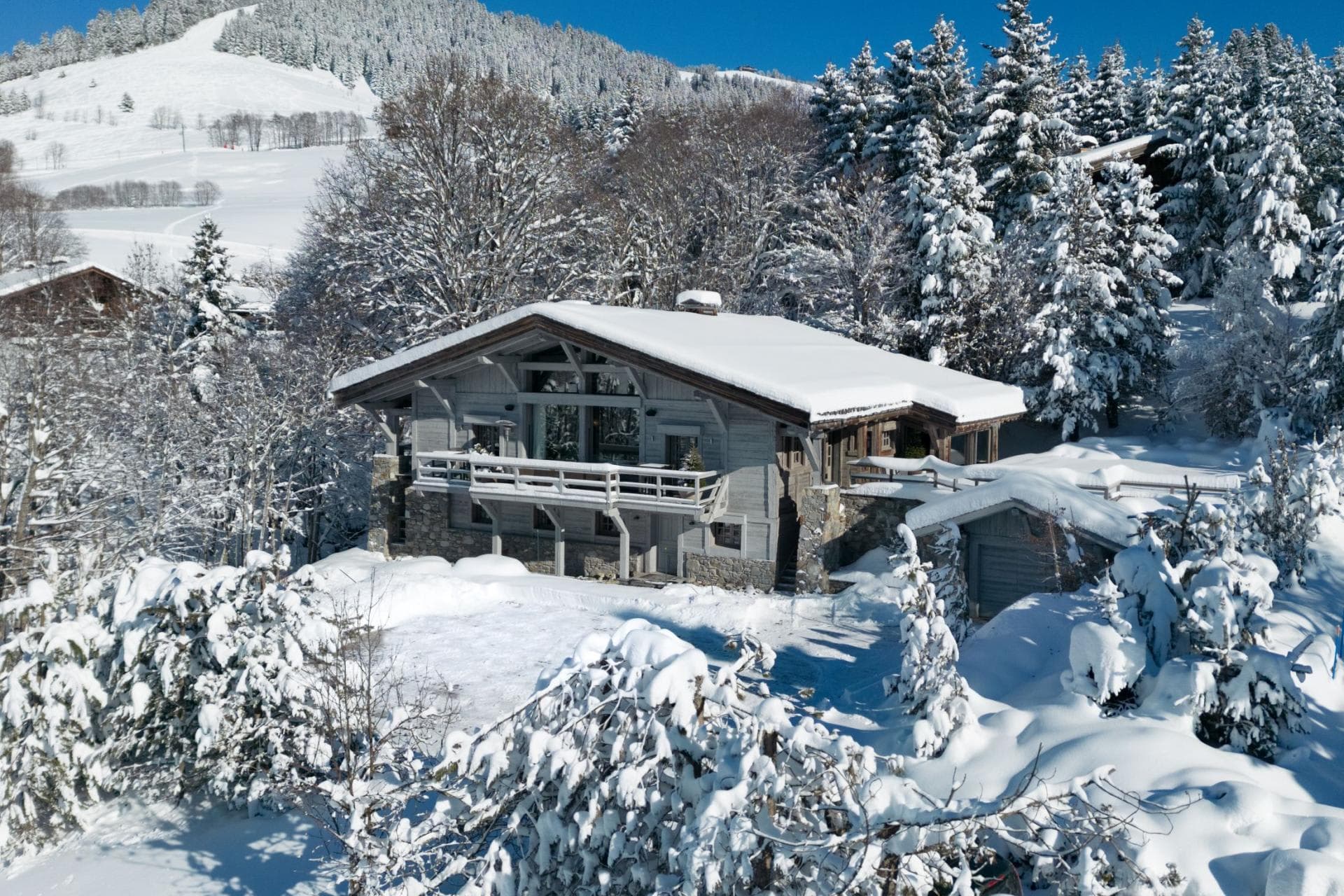 Ski-in/ski-out chalet with private garage and wrap-around balcony