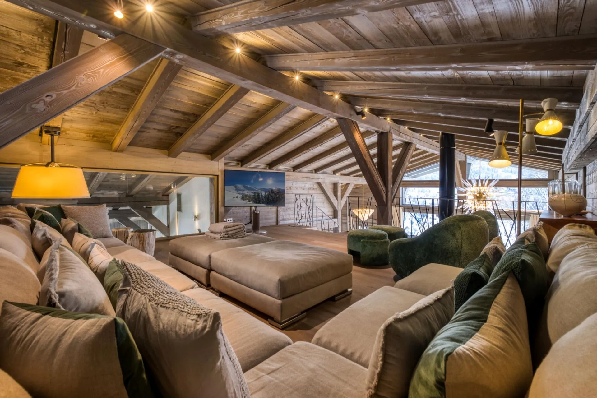 Mezzanine lounge with oversized sectional seating and timber beams