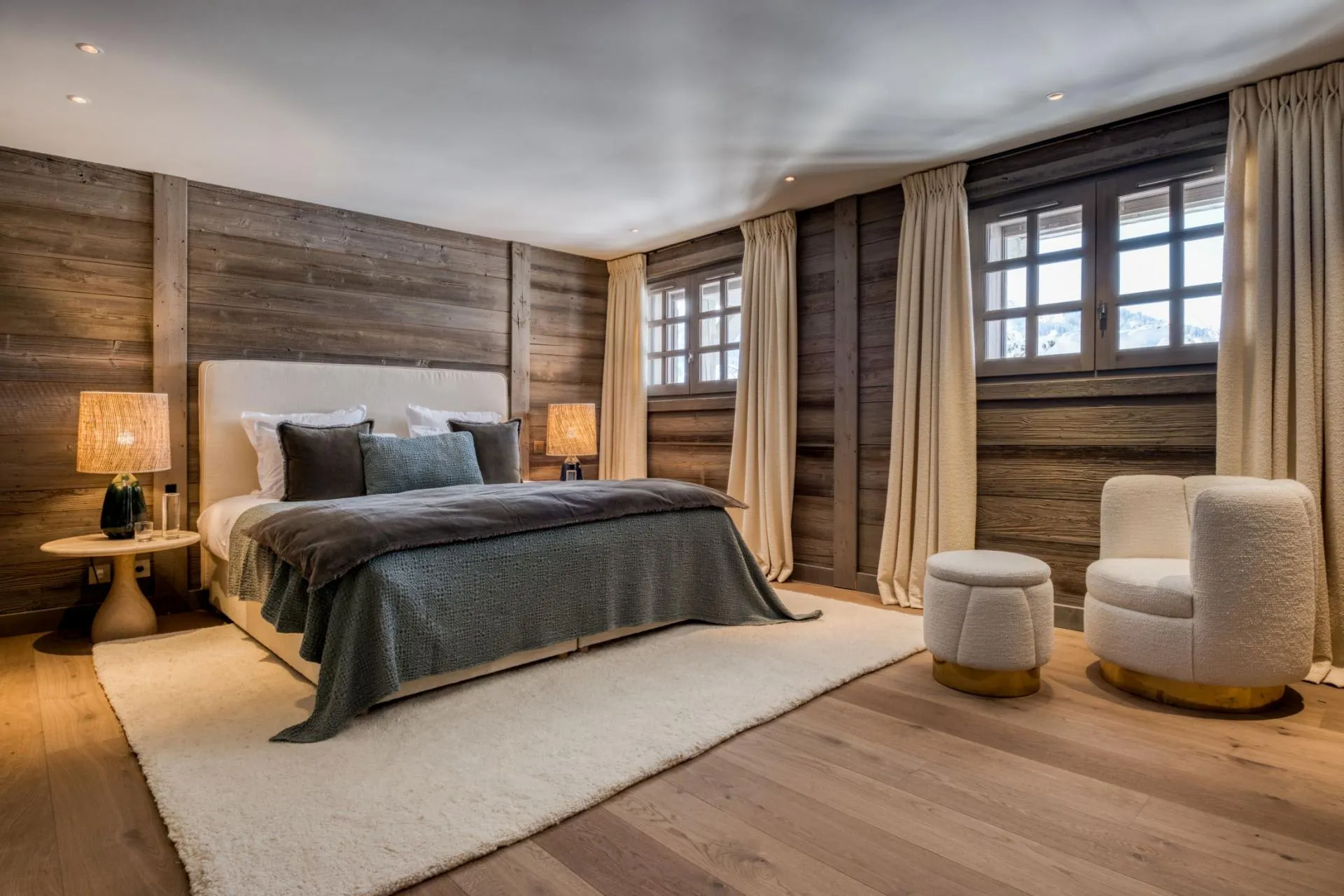 Primary bedroom with king bed and reclaimed wood walls