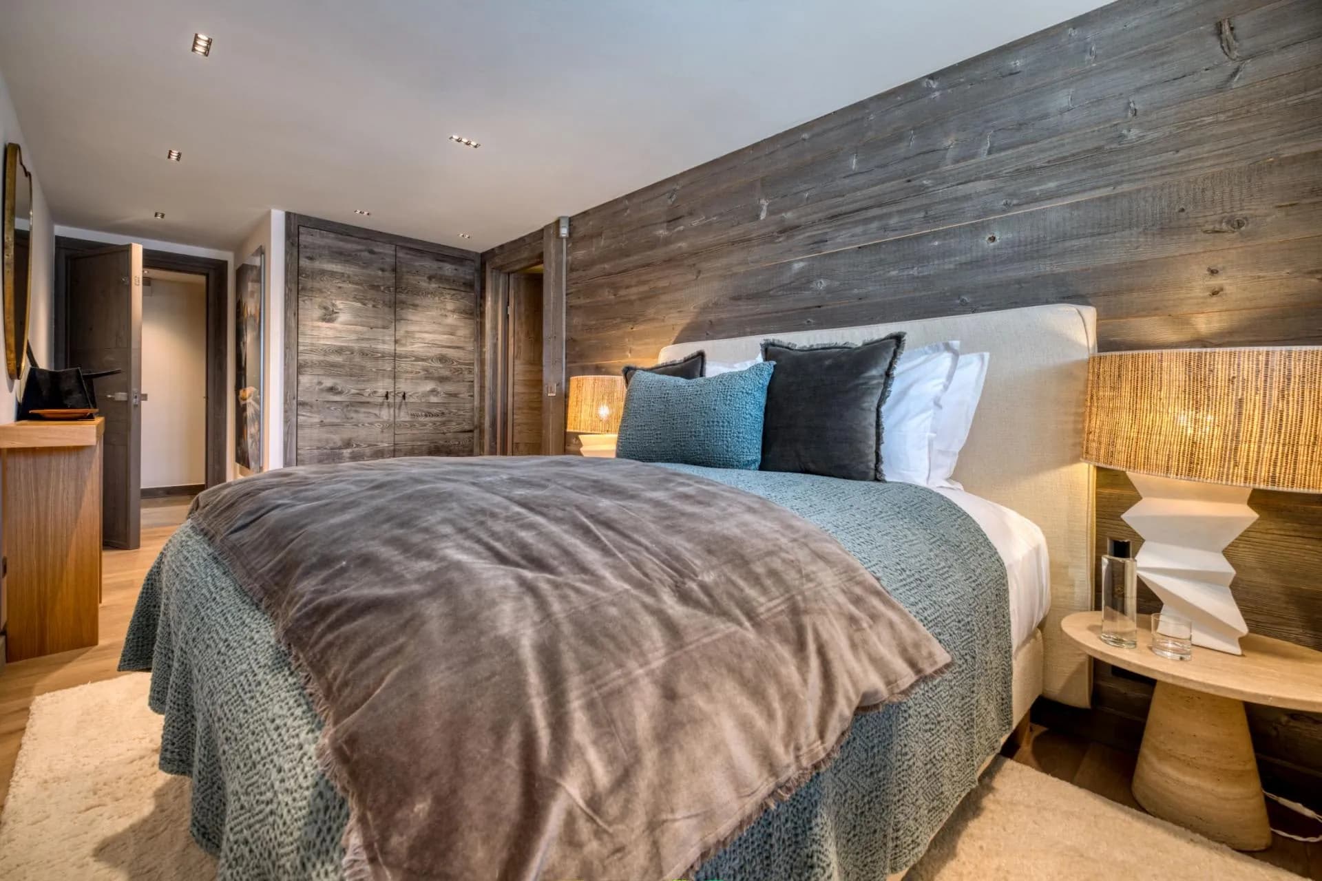 Guest bedroom with queen bed and built-in reclaimed wood closets