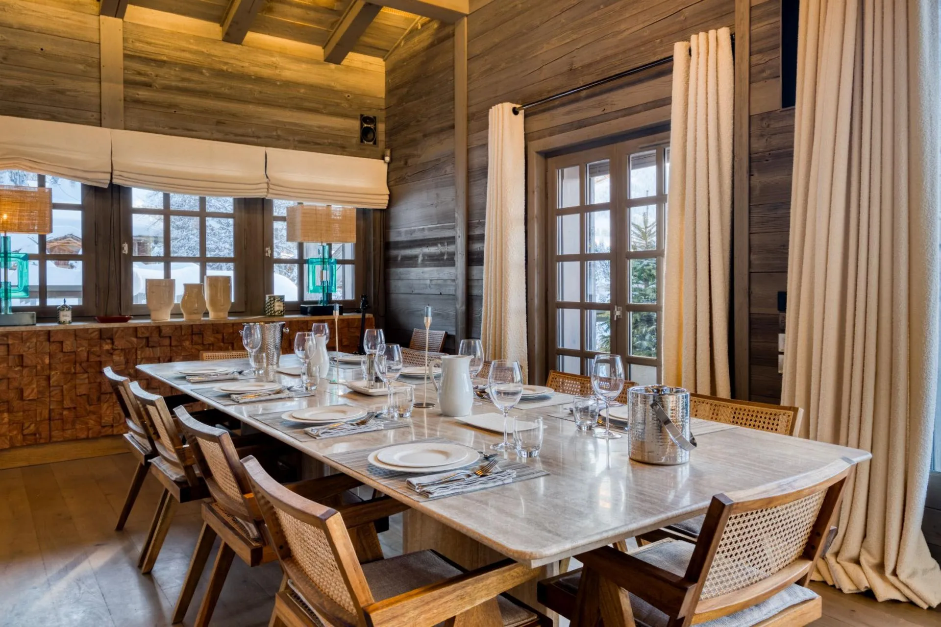 Dining area with seating for 10 and snowy mountain views