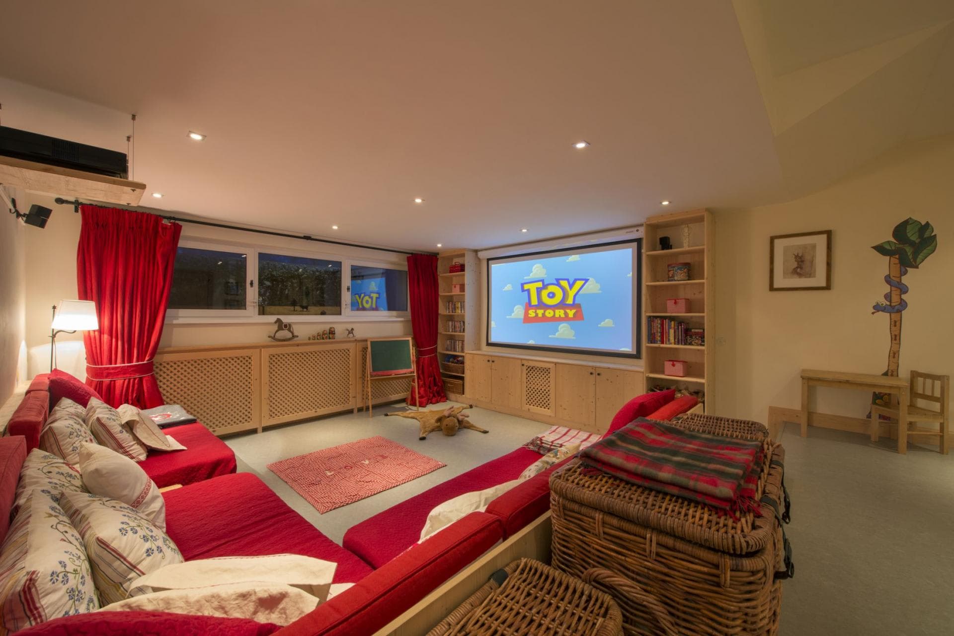 Media room with projector screen and built-in toy storage