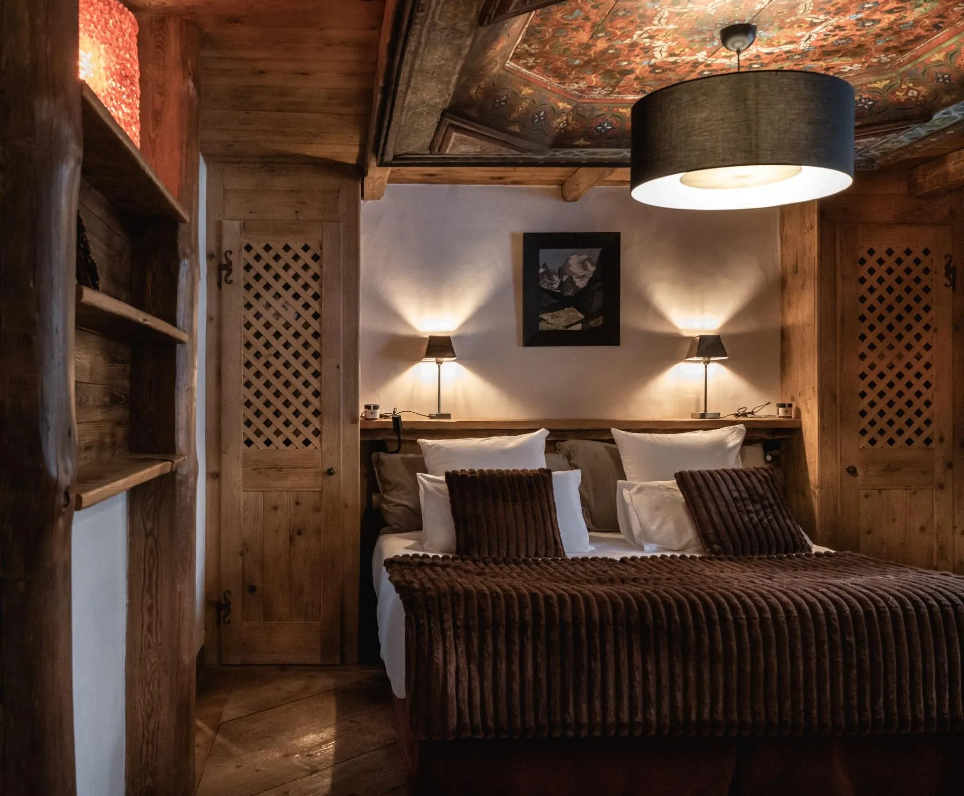 Double bedroom with wardrobe and bedside lamps