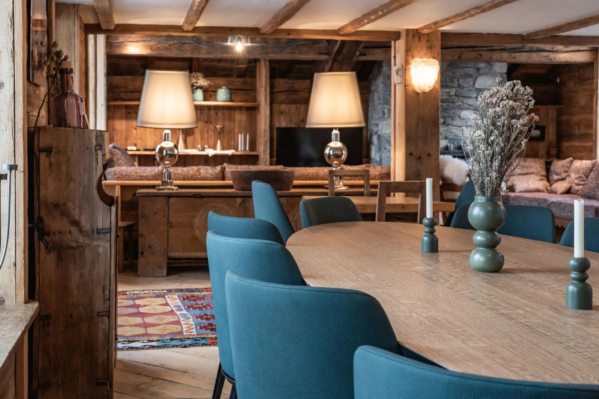Dining table beside the living area and open shelving