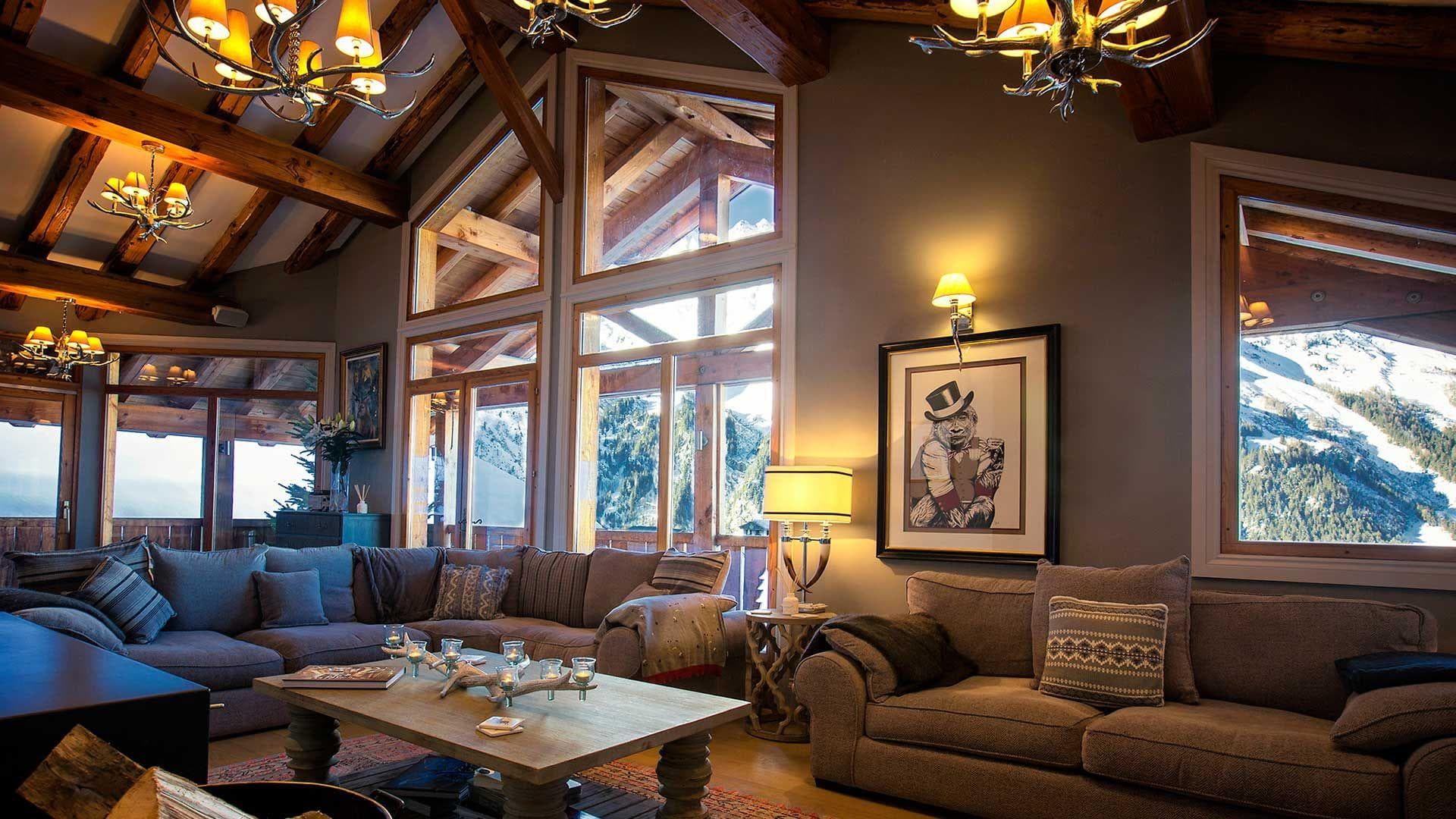 Living area with sectional seating and vaulted ceilings; mountain views