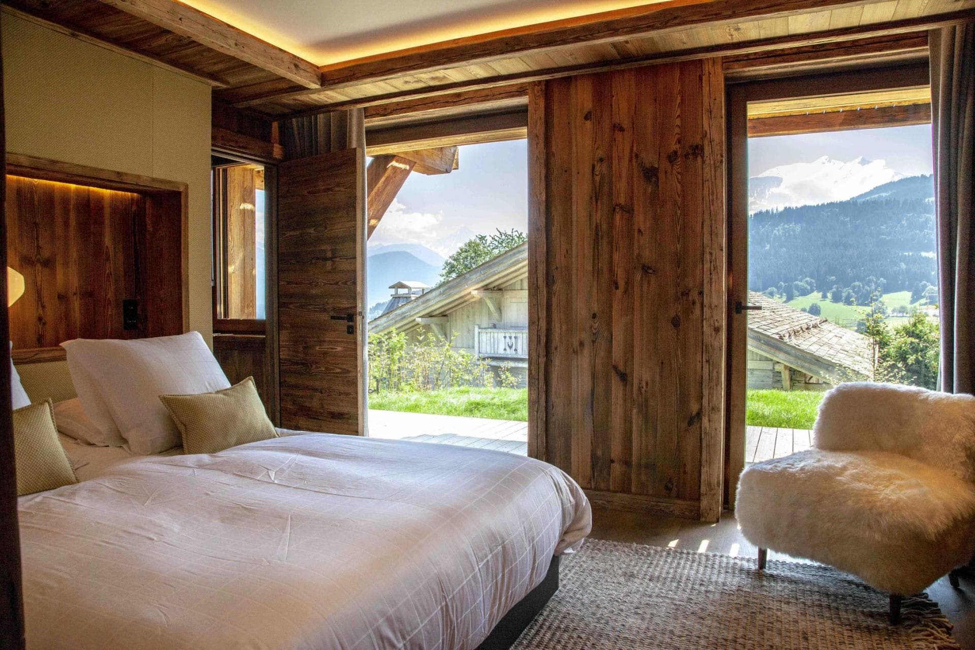 Bedroom with direct terrace access and mountain valley views