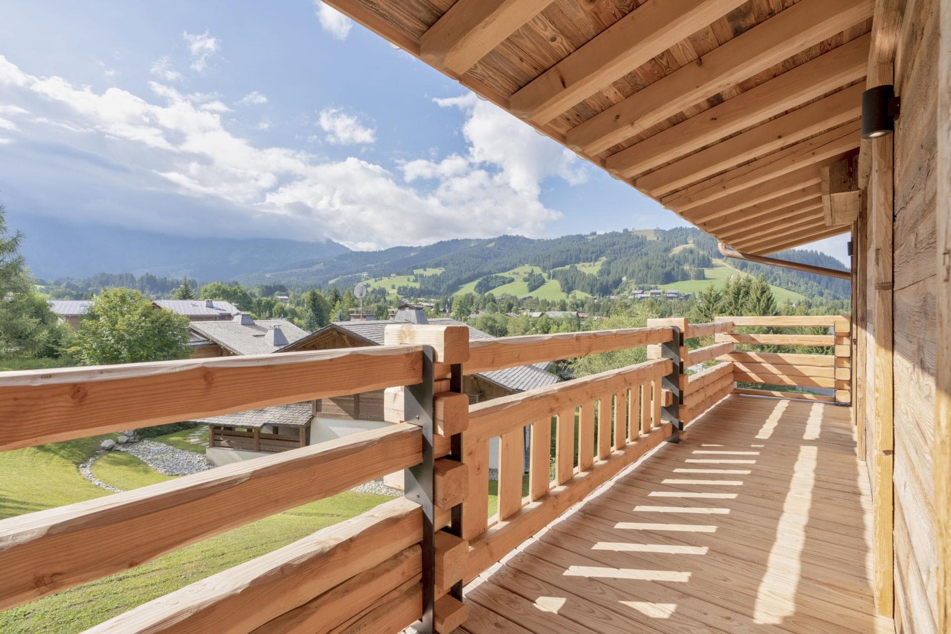 Covered timber balcony with valley and mountain views