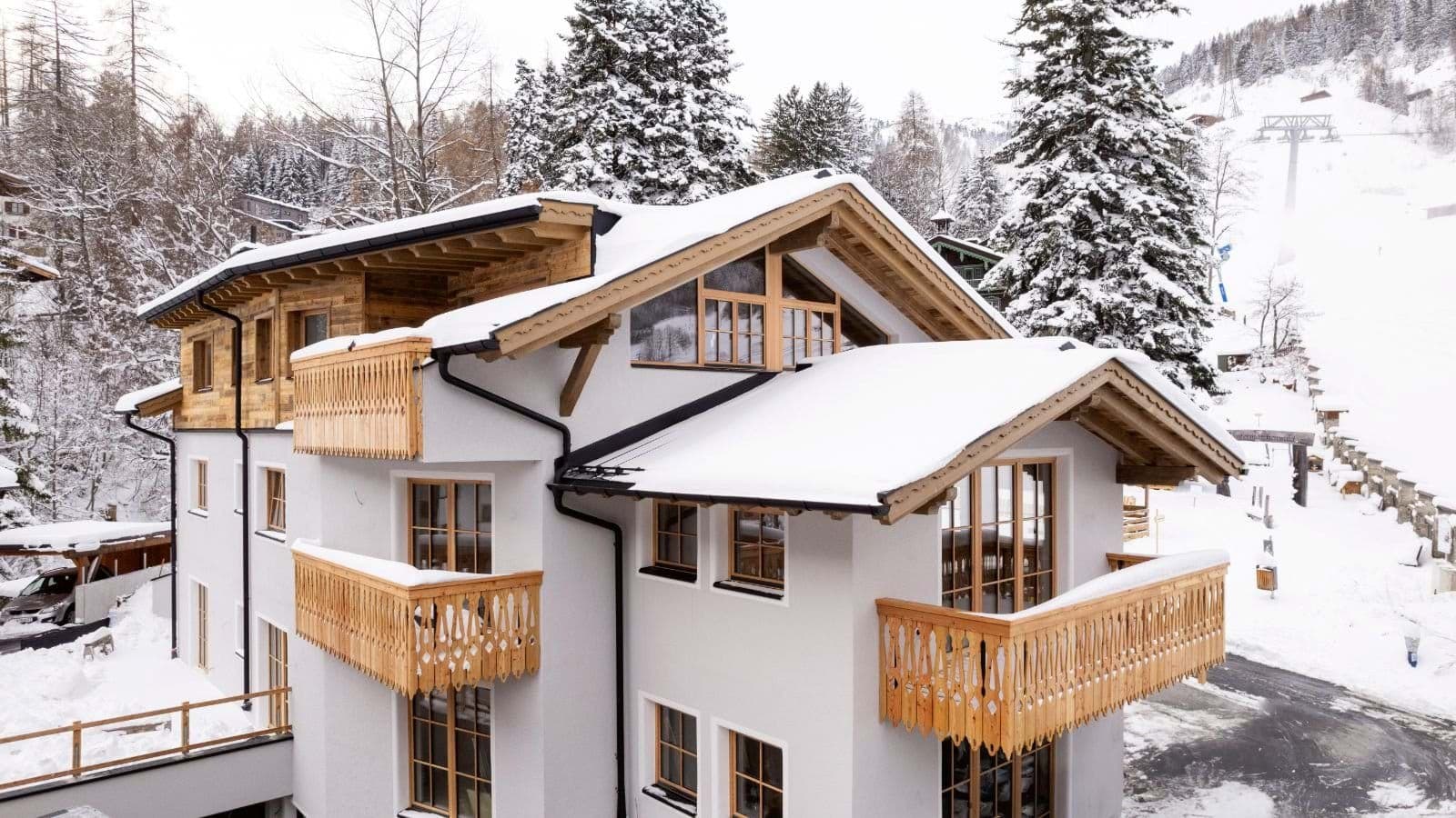 Chalet exterior with multiple balconies and immediate ski lift access
