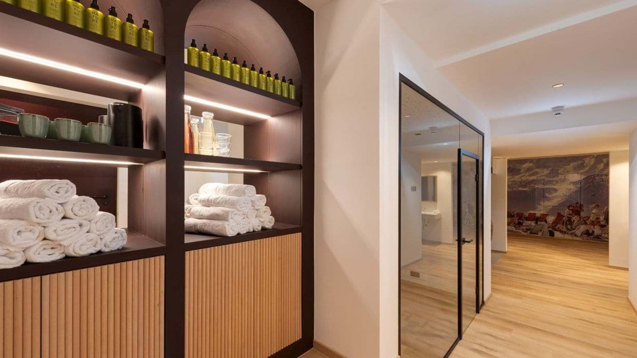 Wellness area entrance with fresh towels and stocked toiletries