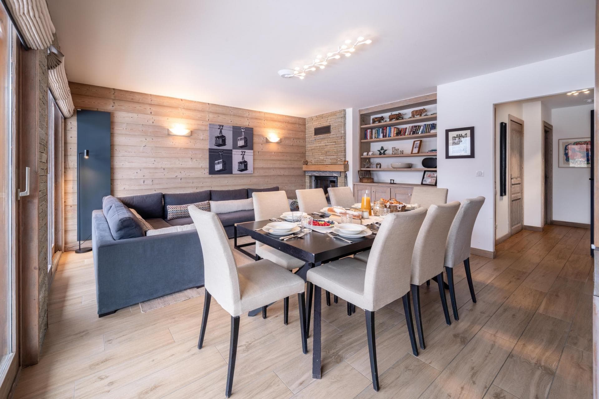 Open-plan dining area seats 8; wood-burning fireplace and terrace access