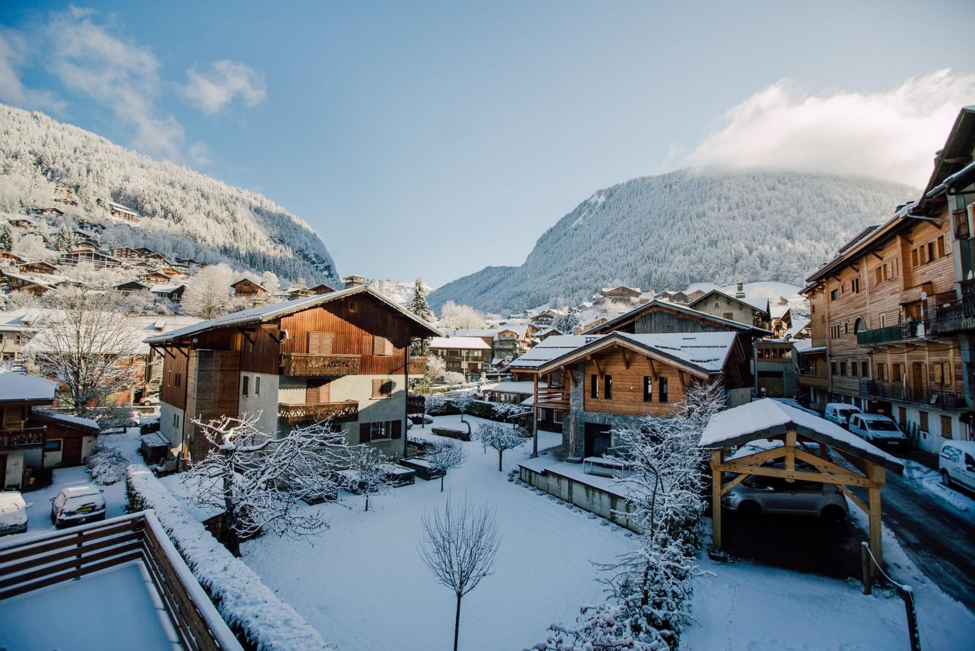 Balcony view of alpine village with covered parking