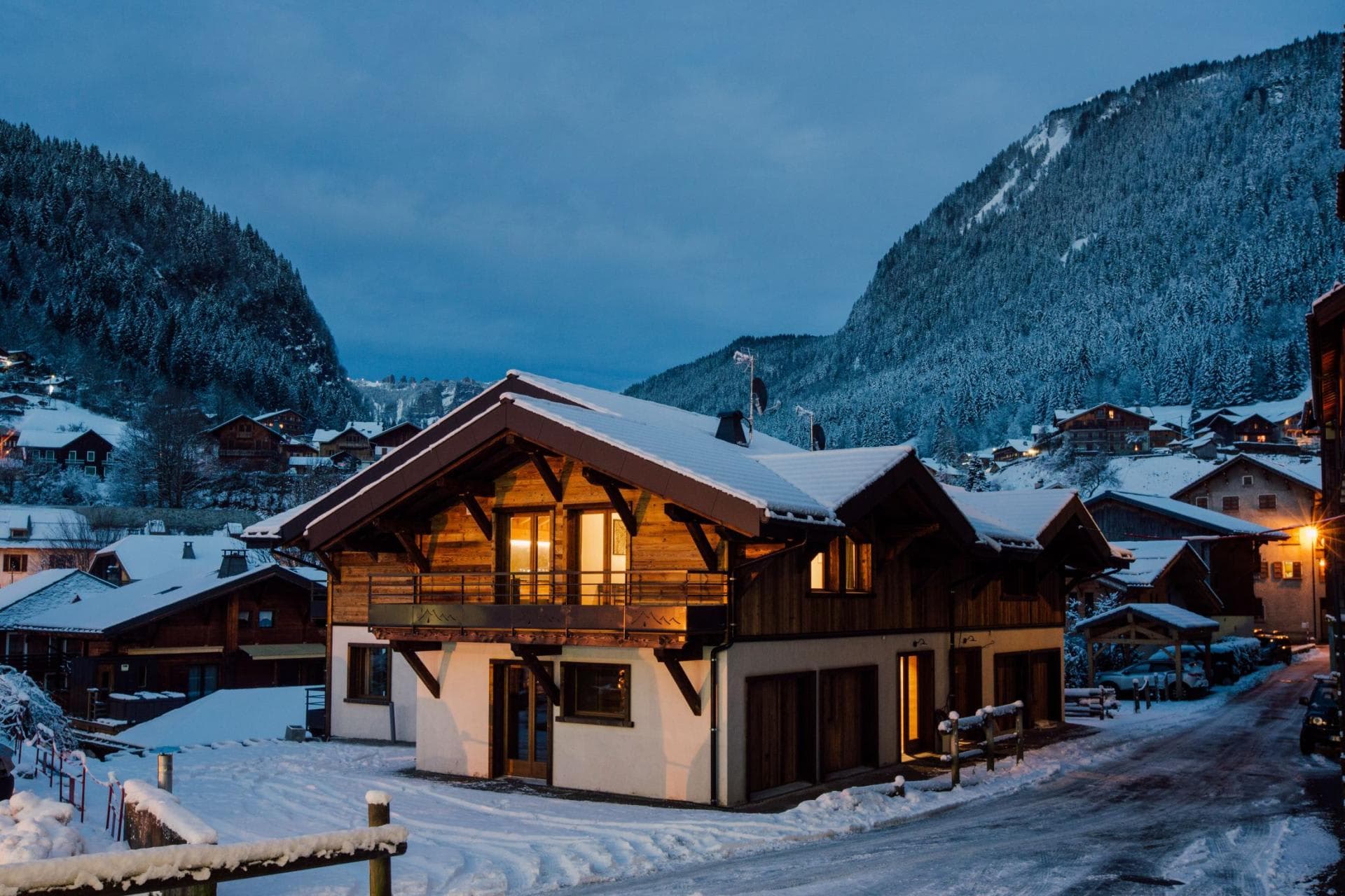Chalet exterior with mountain views and three private garage bays
