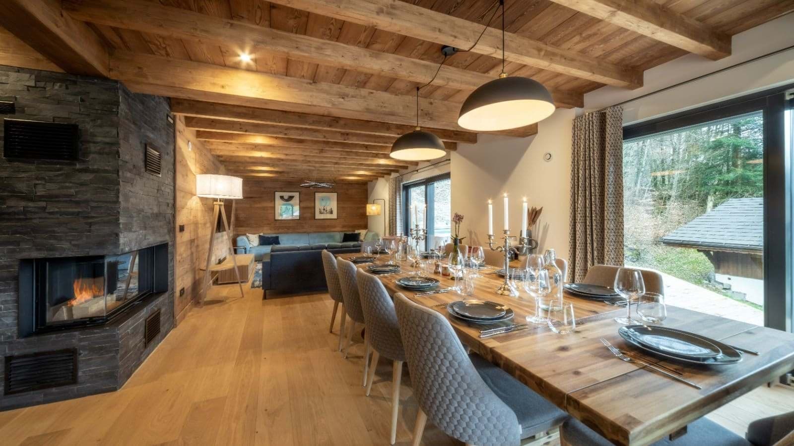 Open-plan dining area seats 10 near wood-burning fireplace