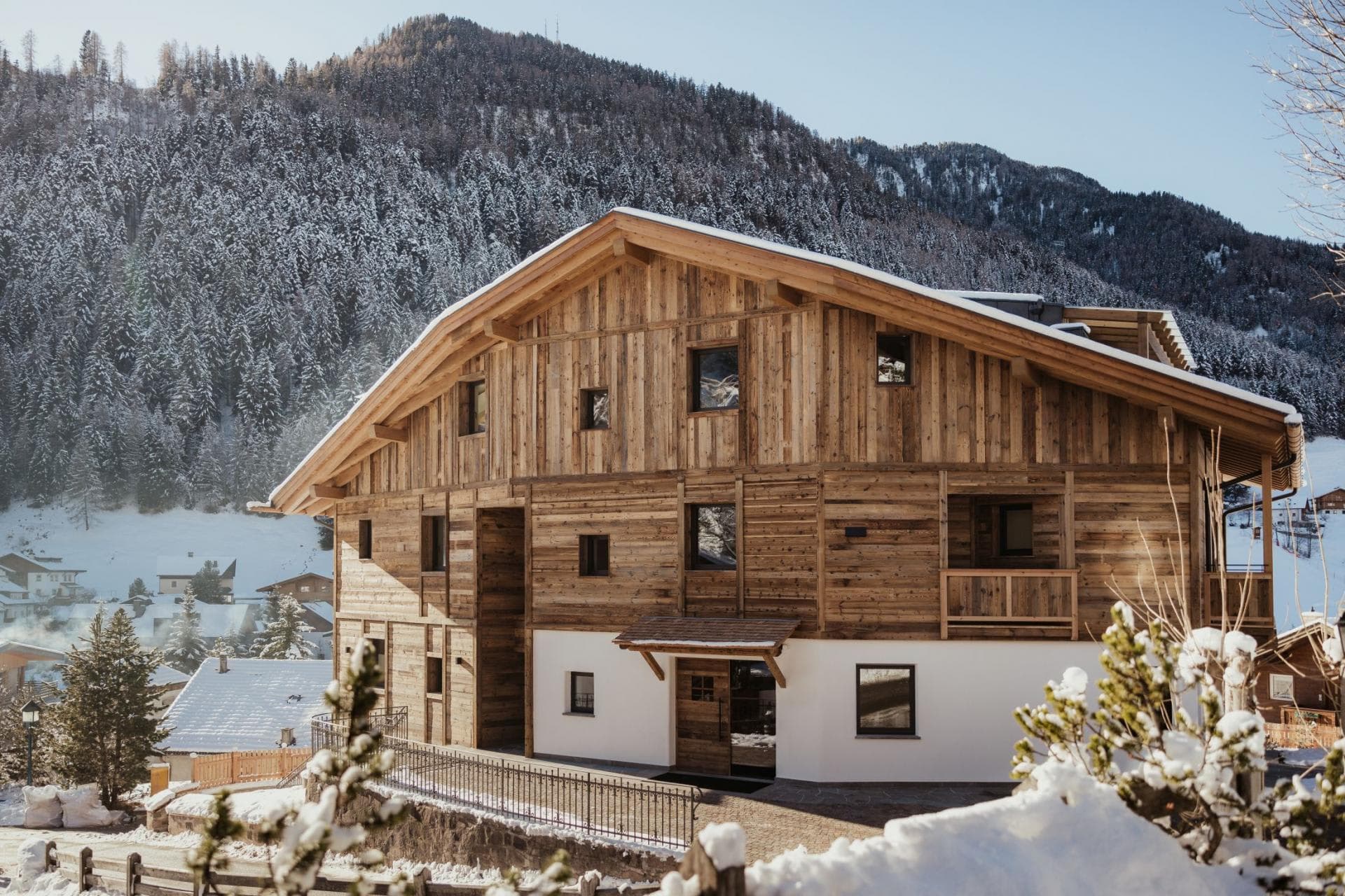 Timber chalet exterior with private balcony and ski-in/ski-out access