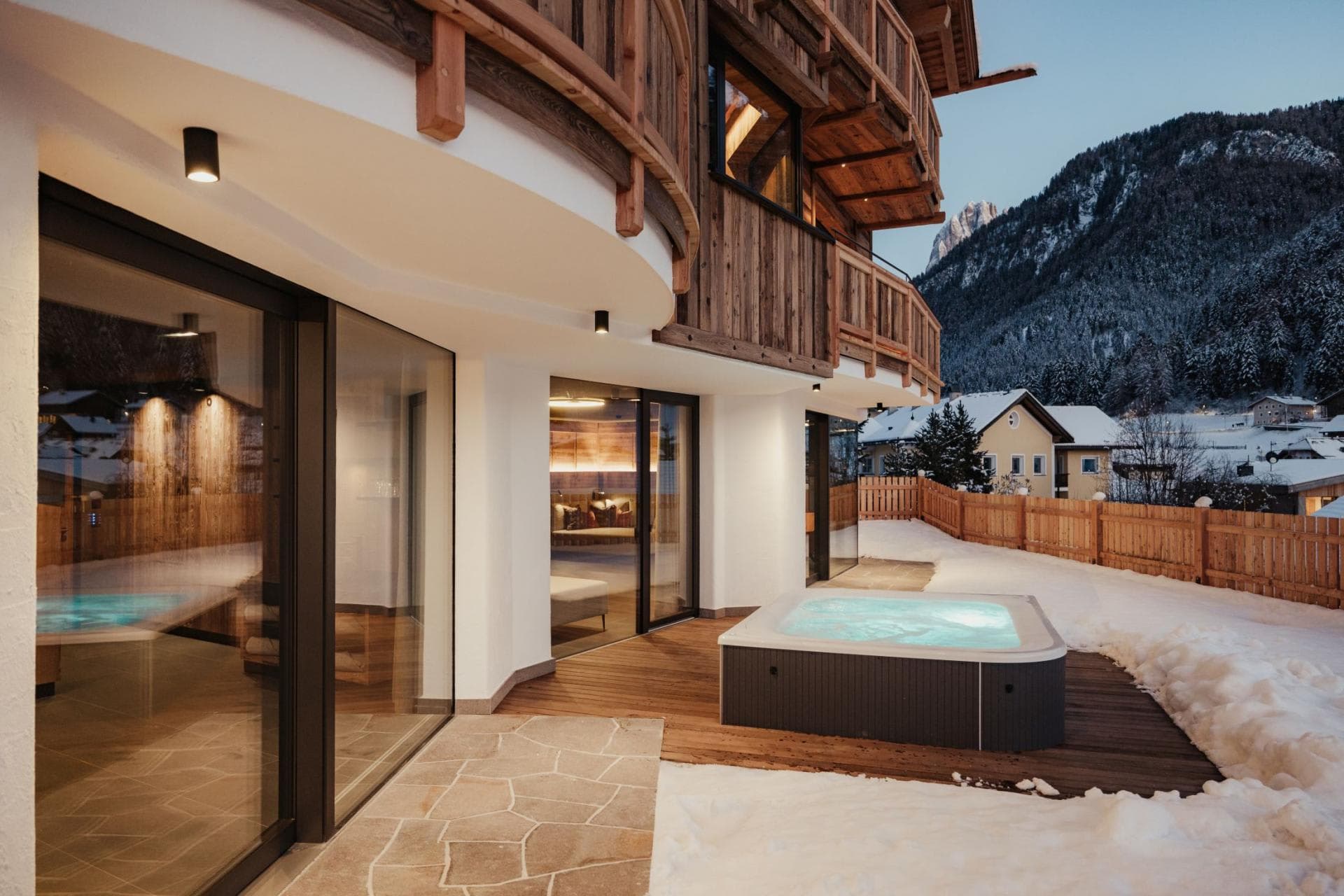 Ground floor patio with hot tub and mountain views