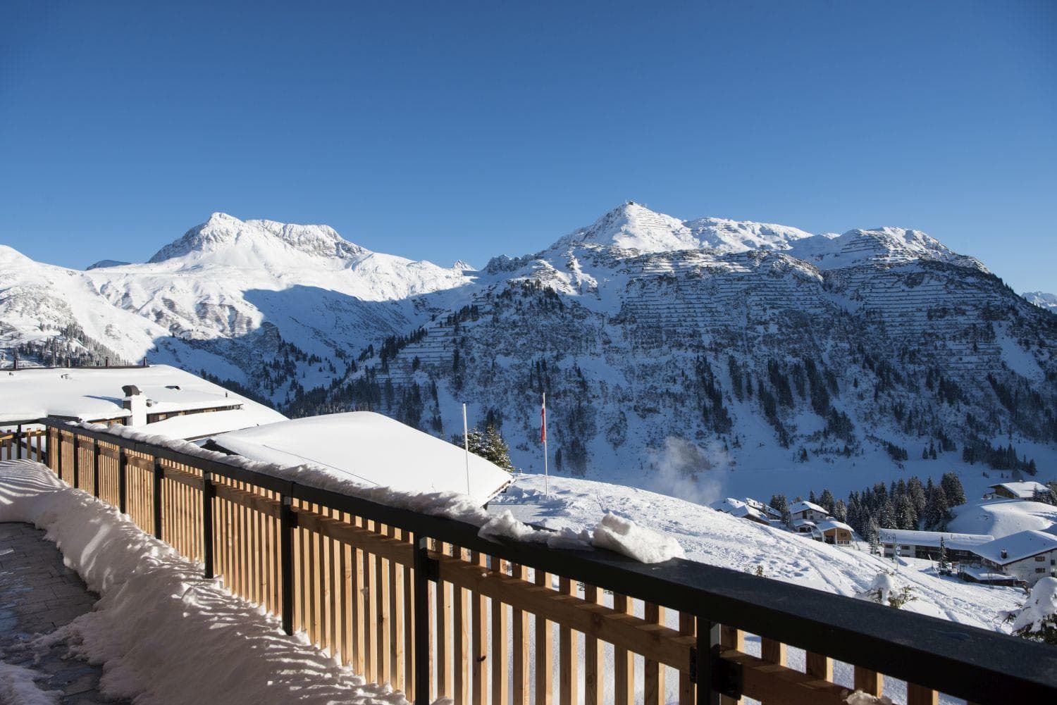 Private balcony with mountain views and direct ski-in/ski-out access