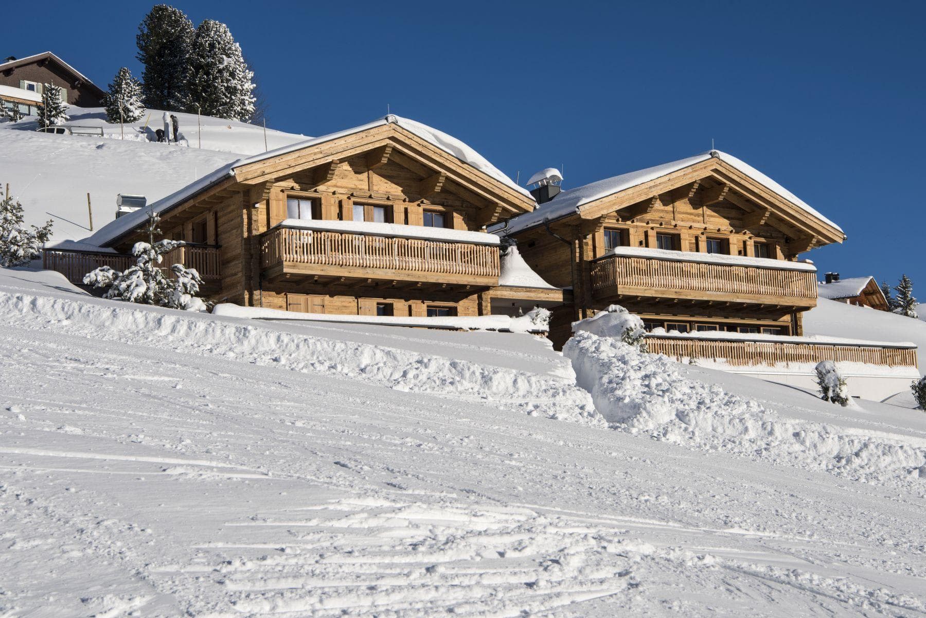 Ski-in, ski-out timber chalets with private balconies and groomed run access