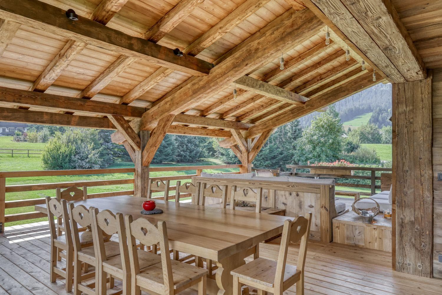 Covered timber deck with dining for 8 and mountain valley views