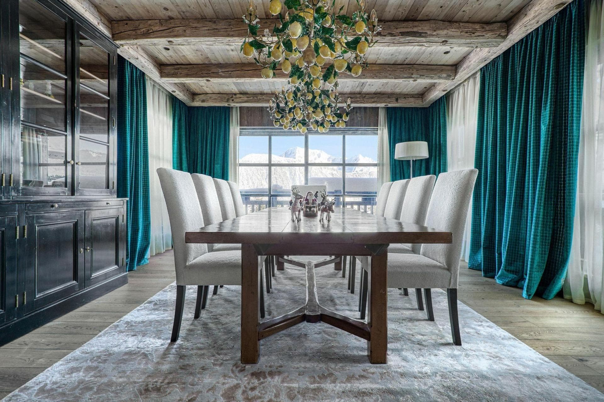 Dining room with seating for 10 and snowy mountain views