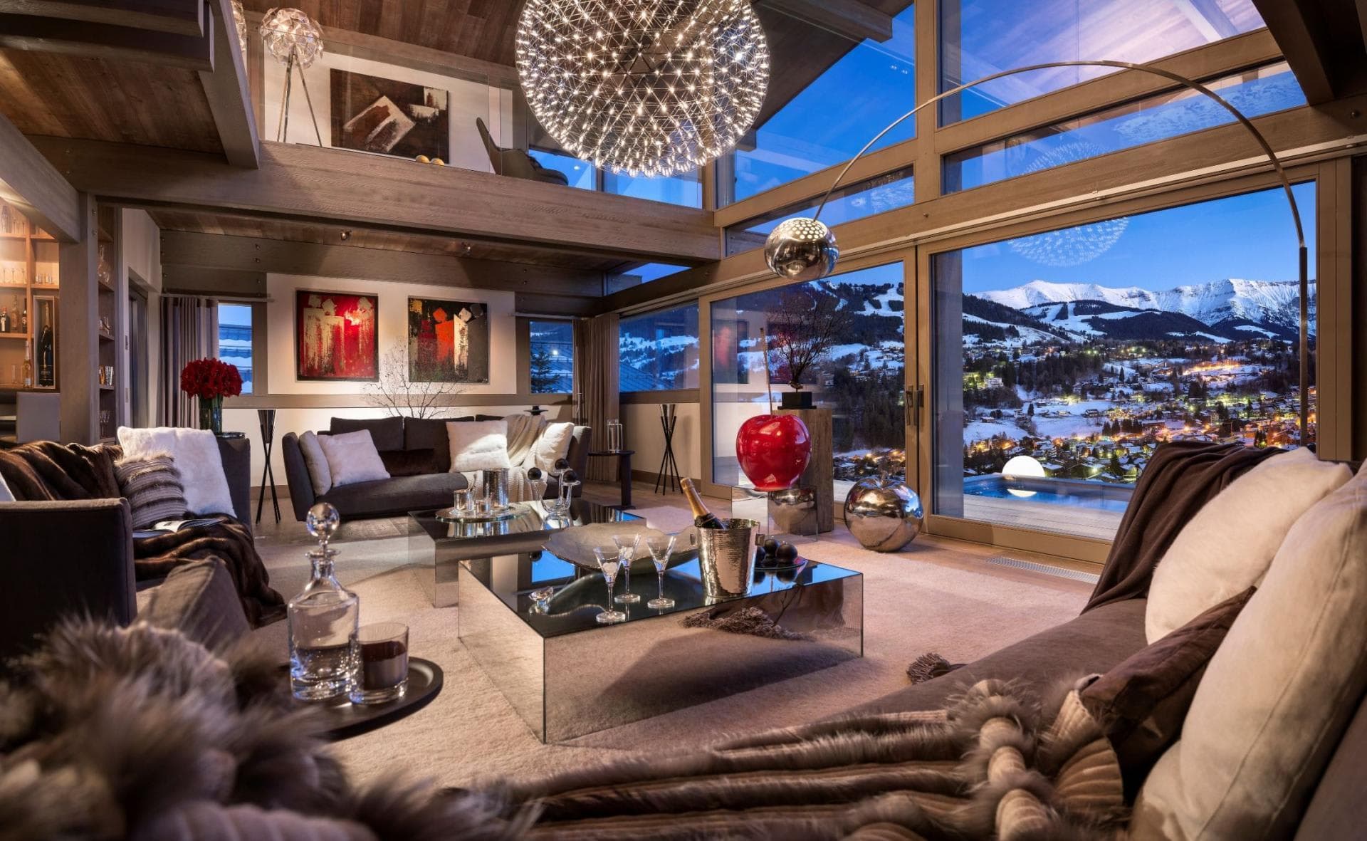 Great room with double-height windows and views of Megeve ski slopes