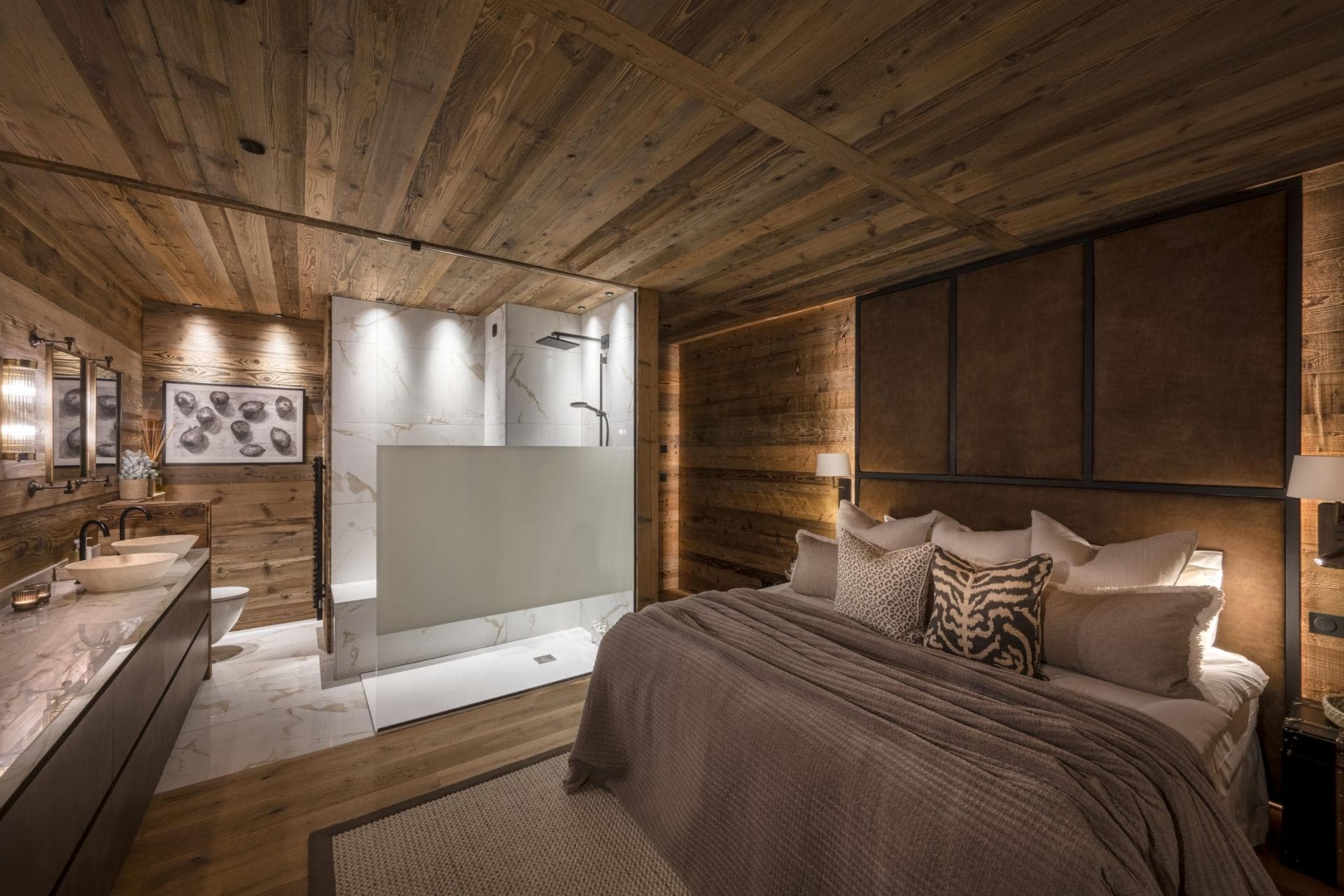 En suite bedroom with king bed and walk-in rainfall shower