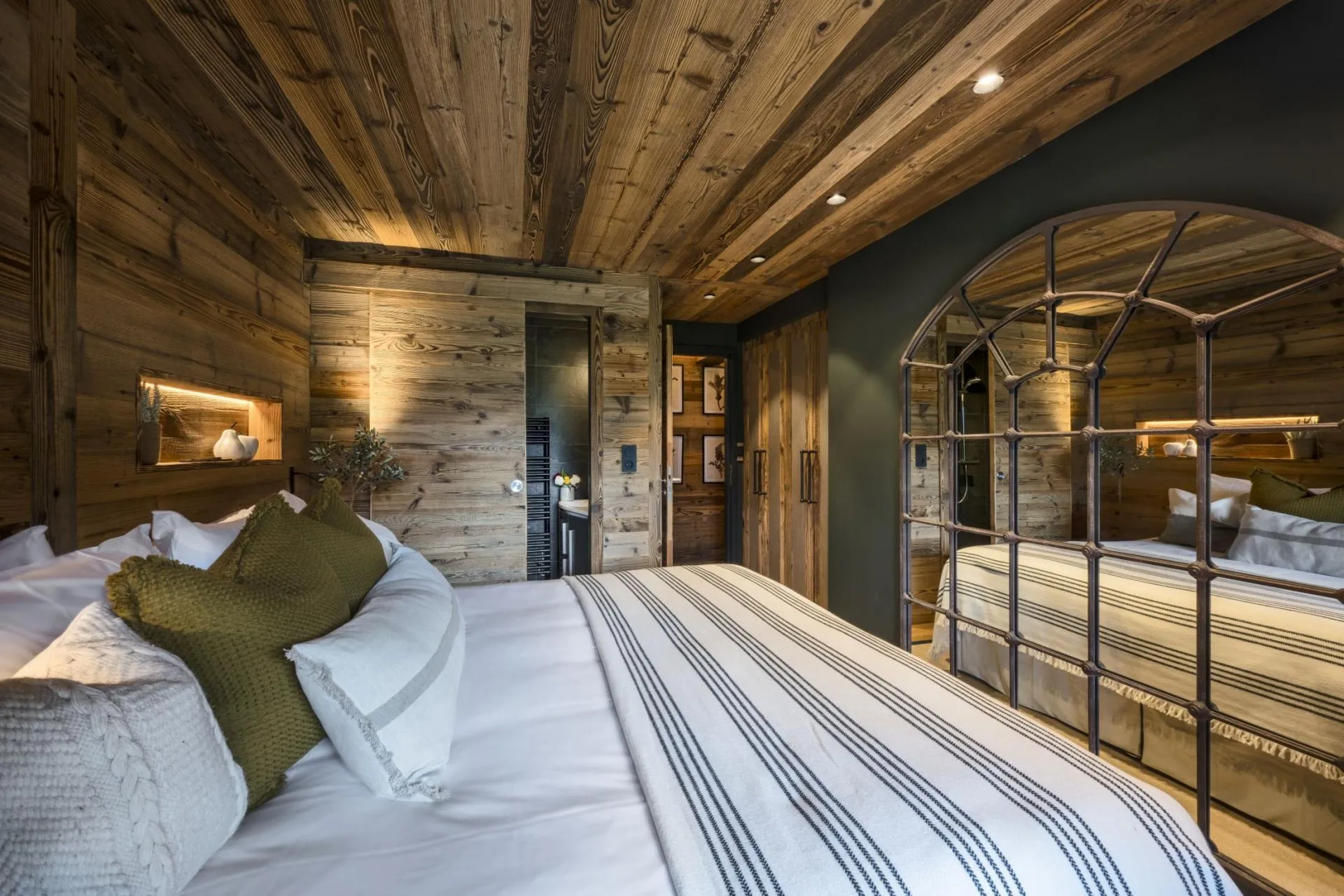 King or twin bedroom with a mirror and timber detailing