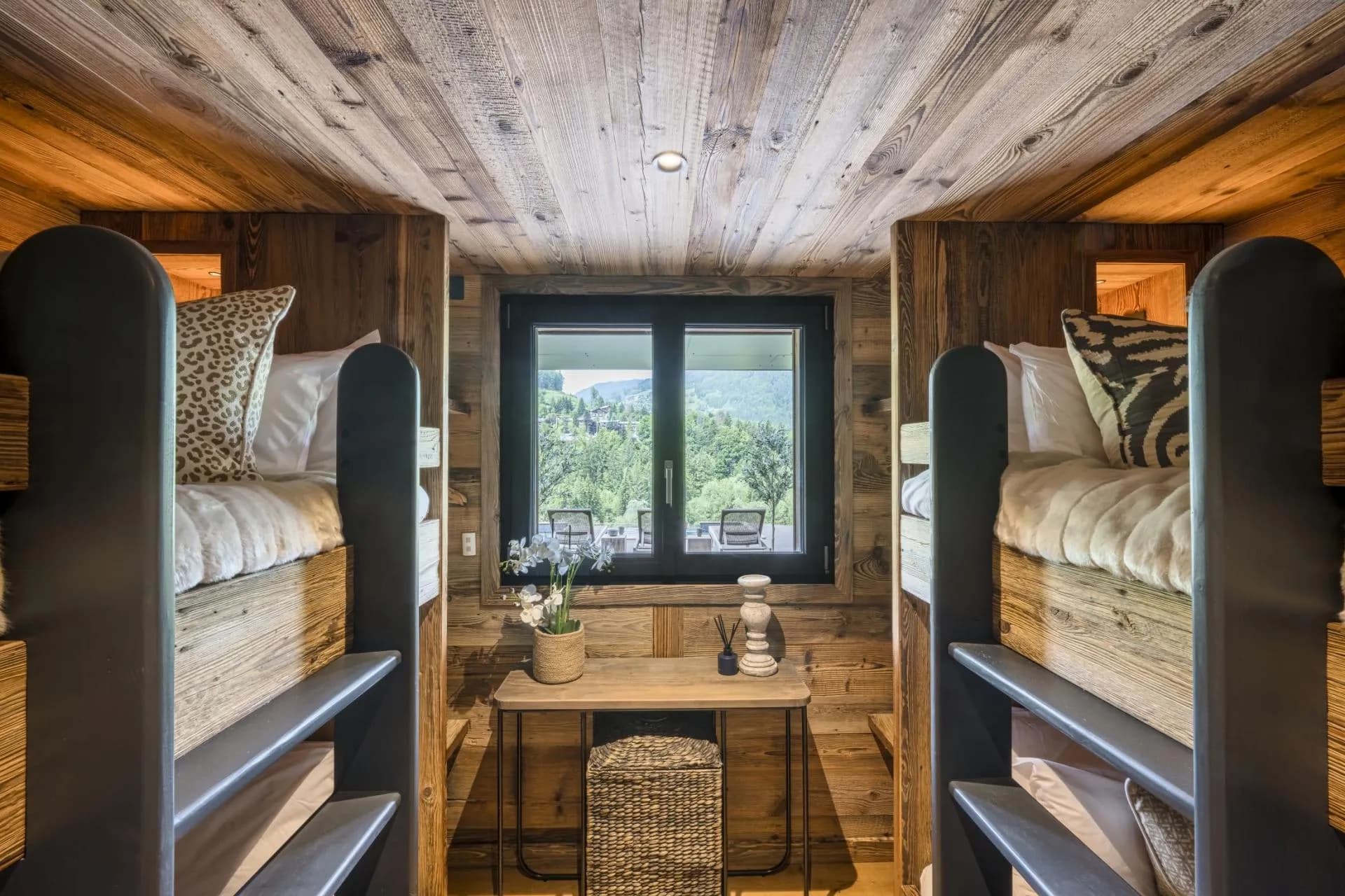 Bunk room with four full-size single beds and valley views