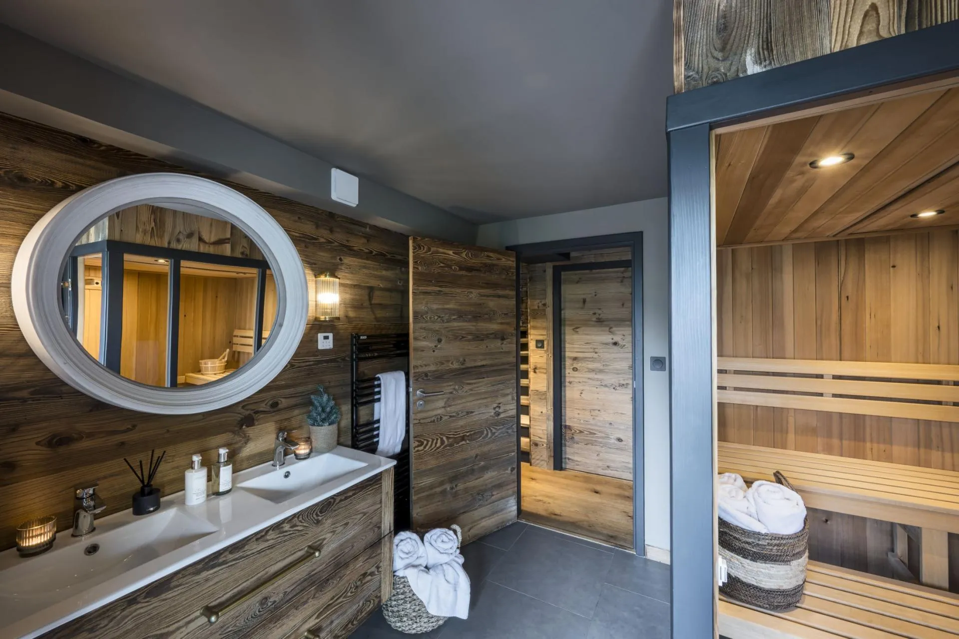Wellness area with a sauna, shower and timber finishes