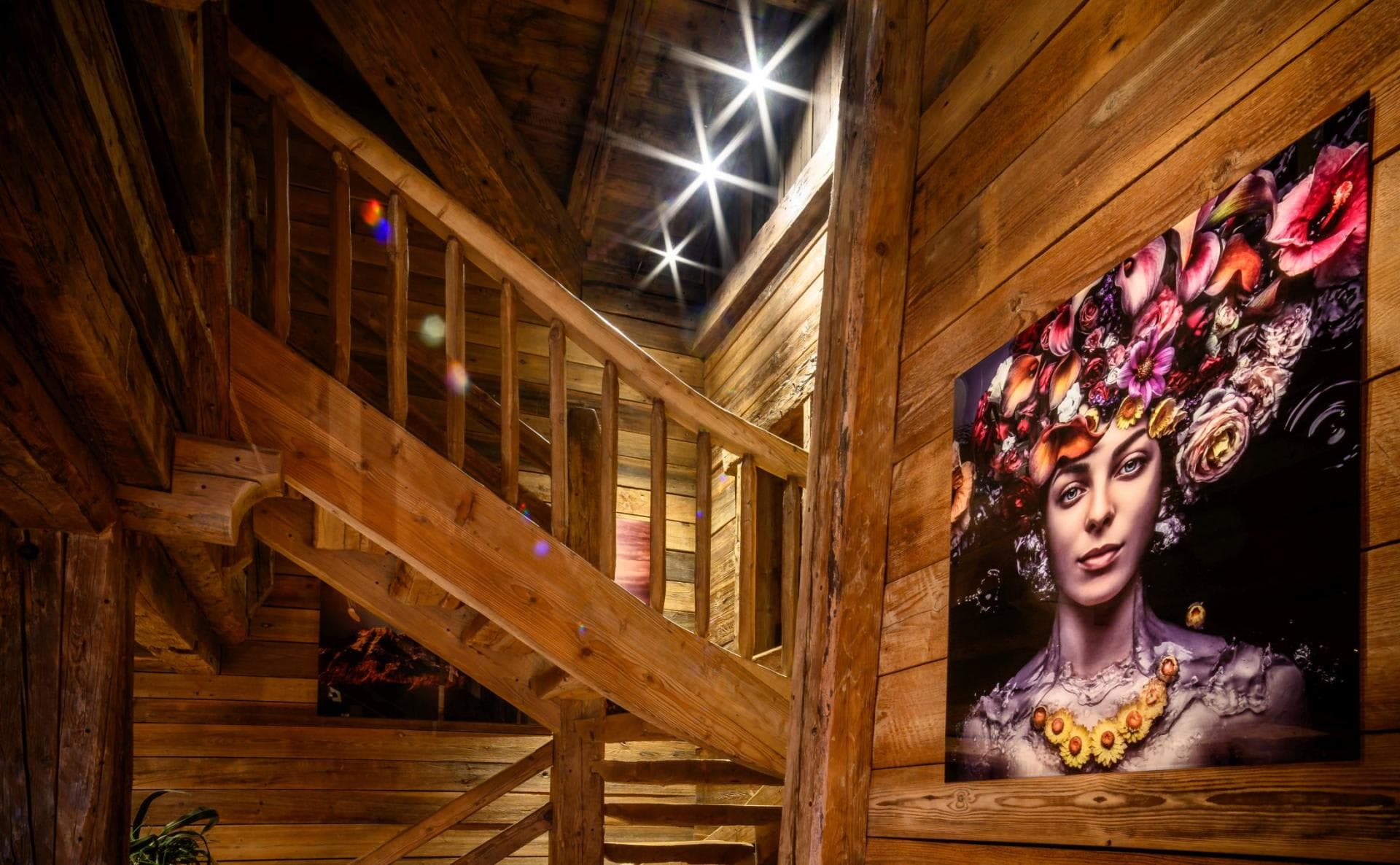 Timber staircase leading to upper level with recessed spotlights