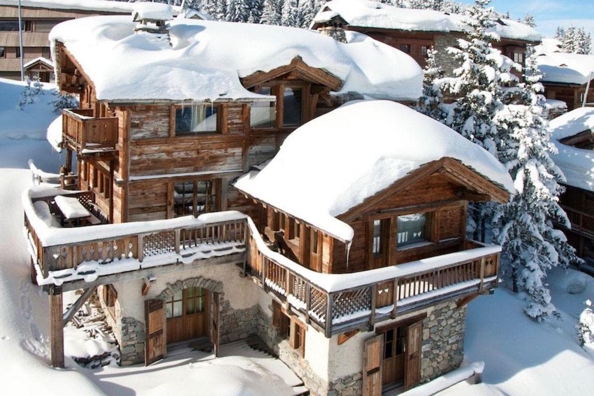 Ski-in/ski-out chalet with private balconies and stone-arched ground entry