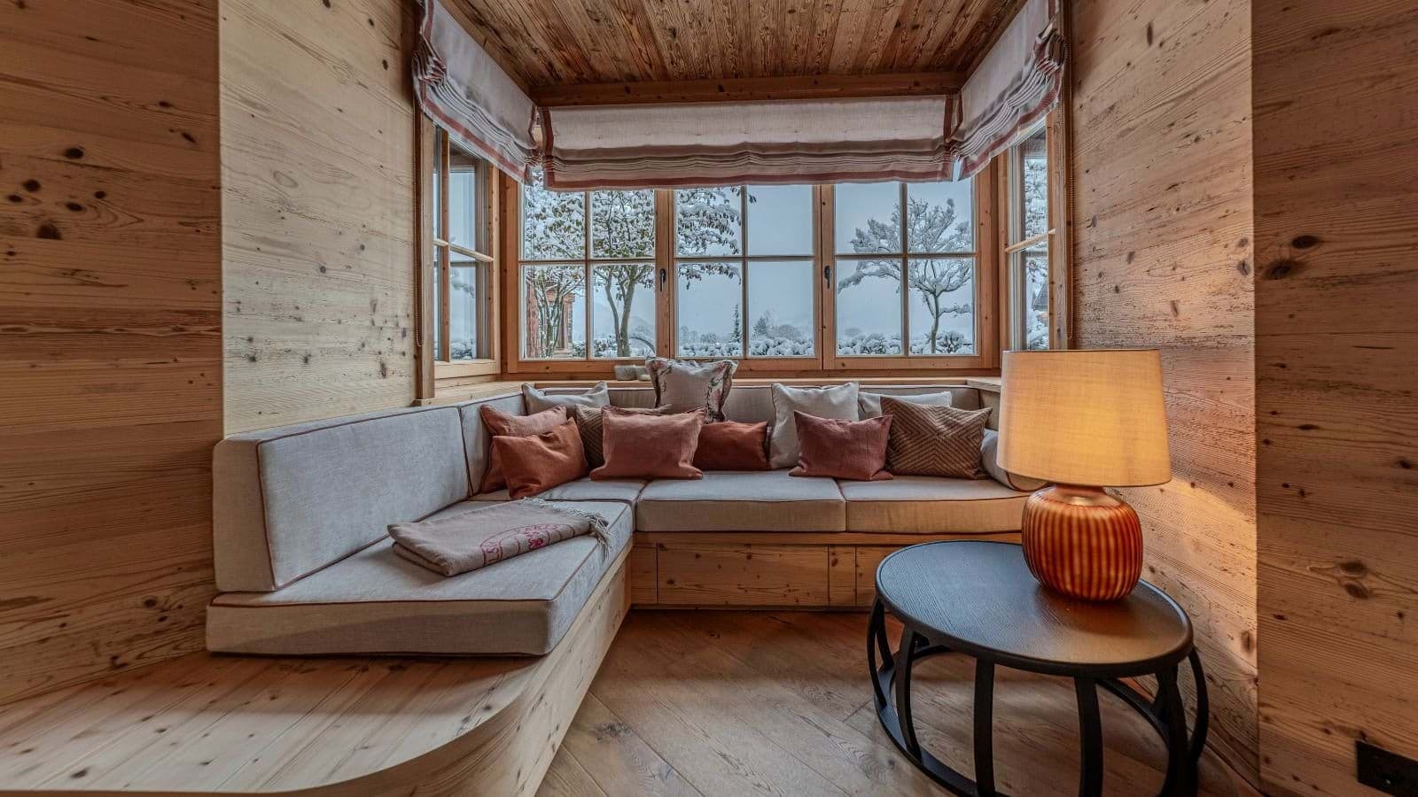 Nook with built-in bench seating and snowy courtyard view