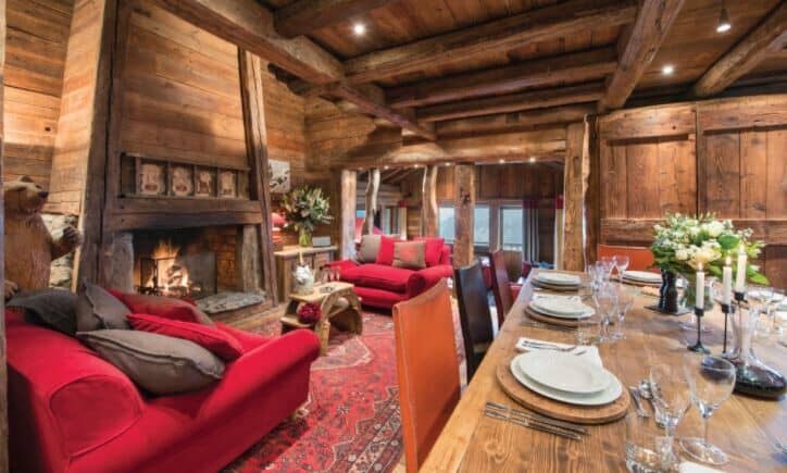 Great room with wood-burning fireplace and dining table seating 10