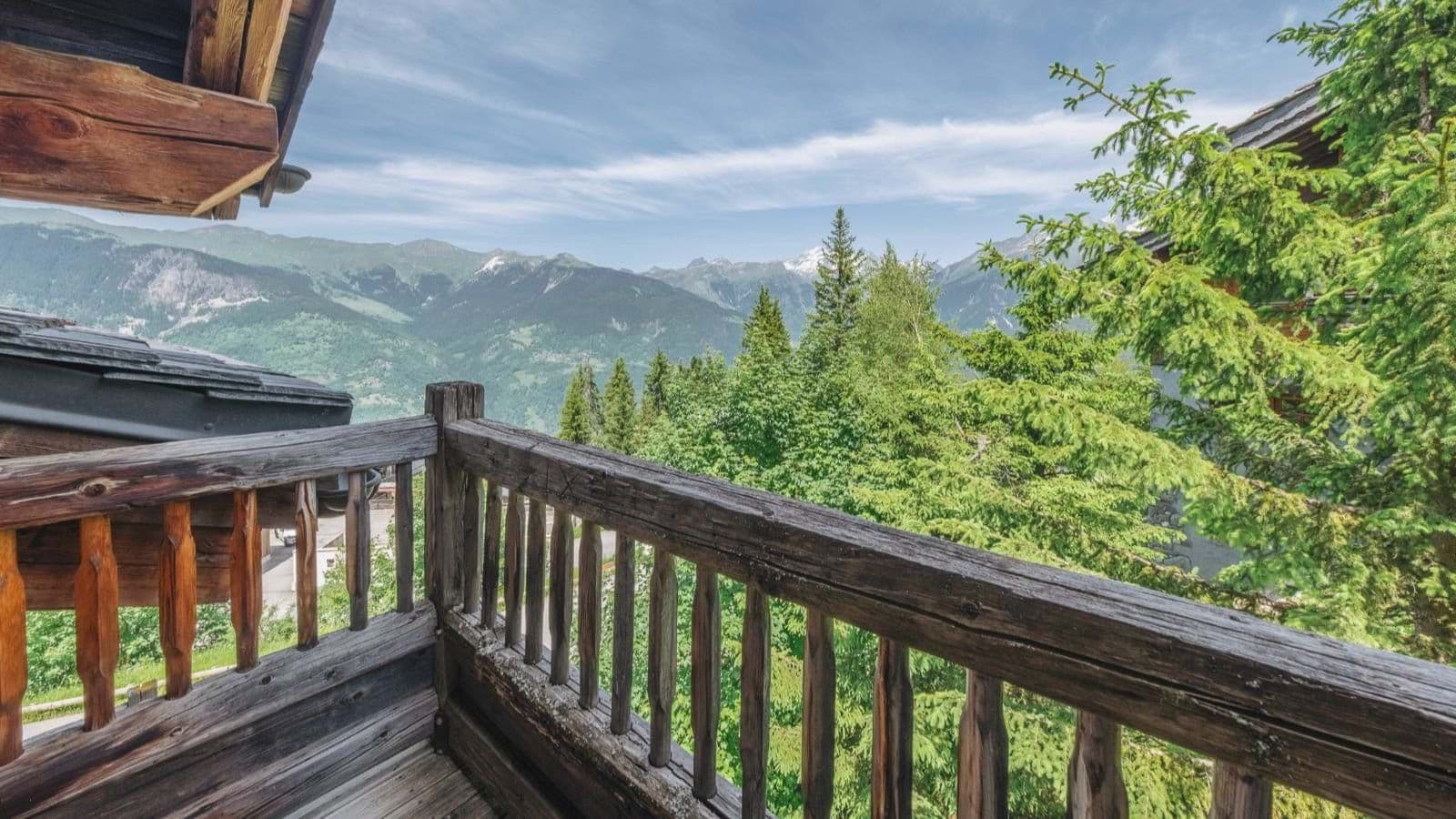 Private balcony with views of valley and distant snow-capped peaks