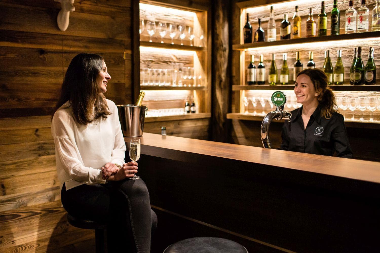 Private timber bar with draft beer and built-in bottle shelving